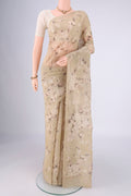 Dark Beige Chanderi Silk Cotton Saree with Floral Print on the body and Zari Border.  displayed on a mannequin