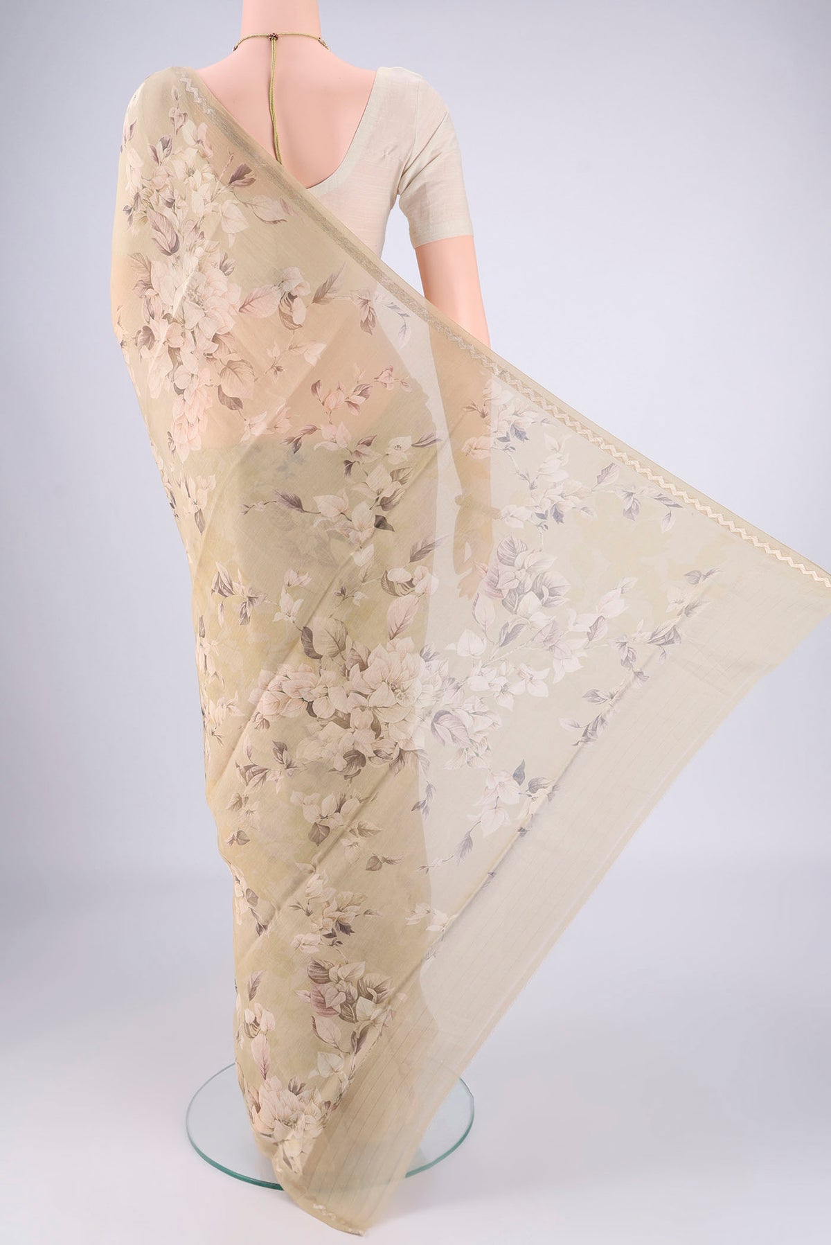 Flat view of Dark Beige Chanderi Silk Cotton Saree with Floral Print on the body and Zari Border. 