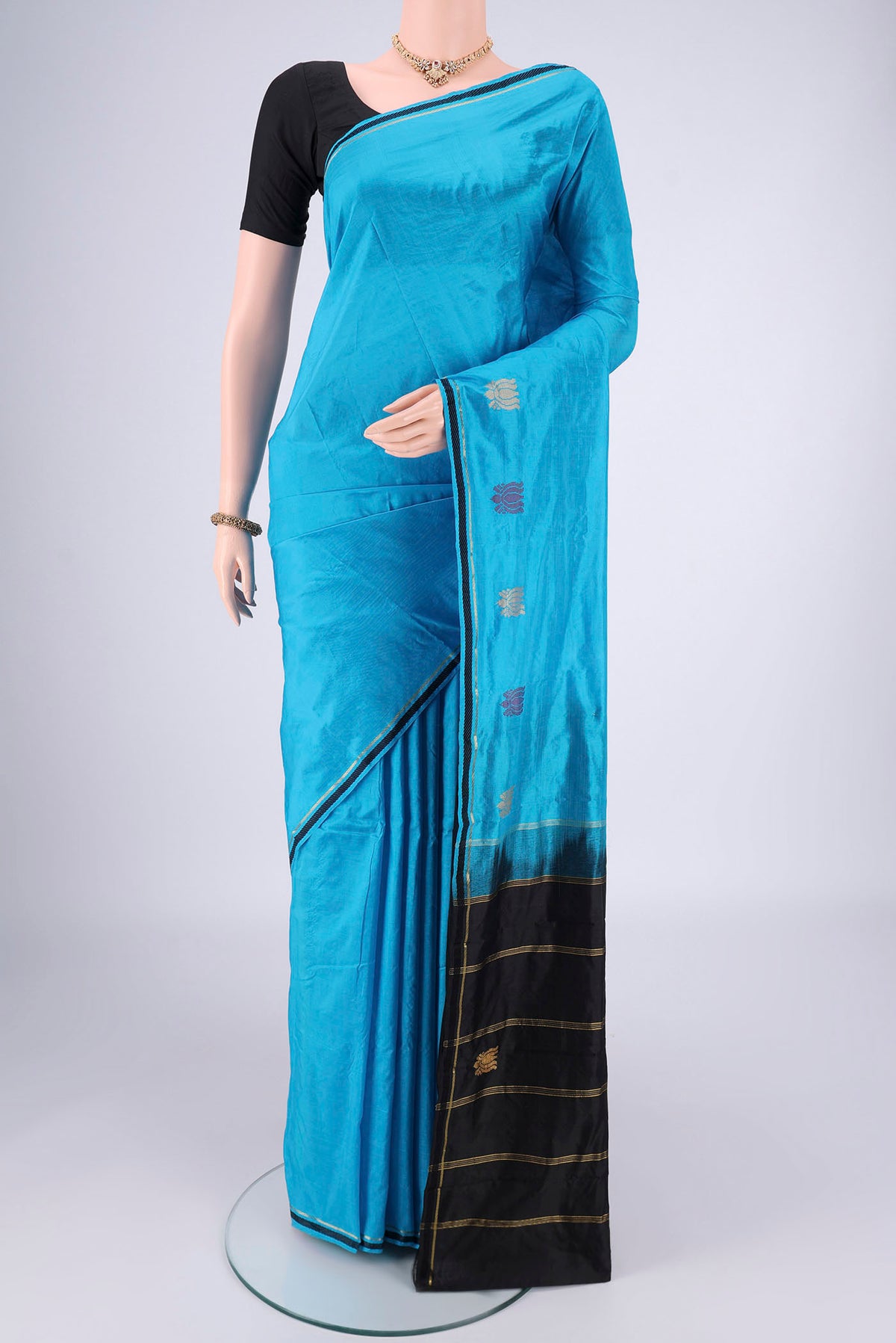 Blue Dual Tone Kanchipuram Saree with Plain Body and Zari And Thread Border.  displayed on a mannequin