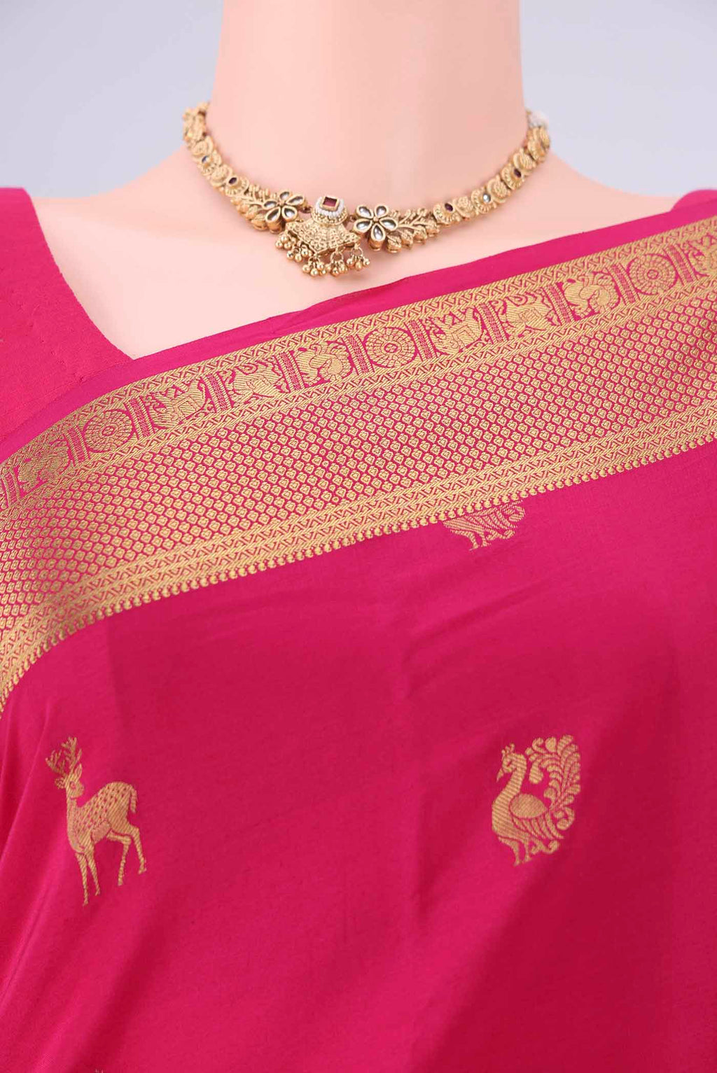 Border image of Rani Pink Mysore Crepe Saree with Zari Butta on the body and Zari Border. 