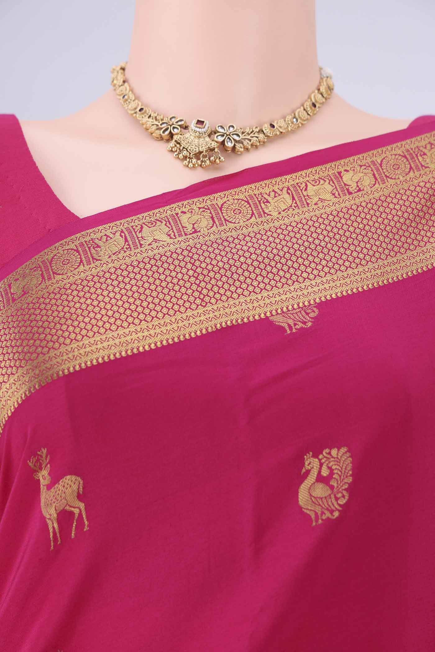 Border image of Rani Pink Mysore Crepe Saree with Zari Butta on the body and Zari Border. 
