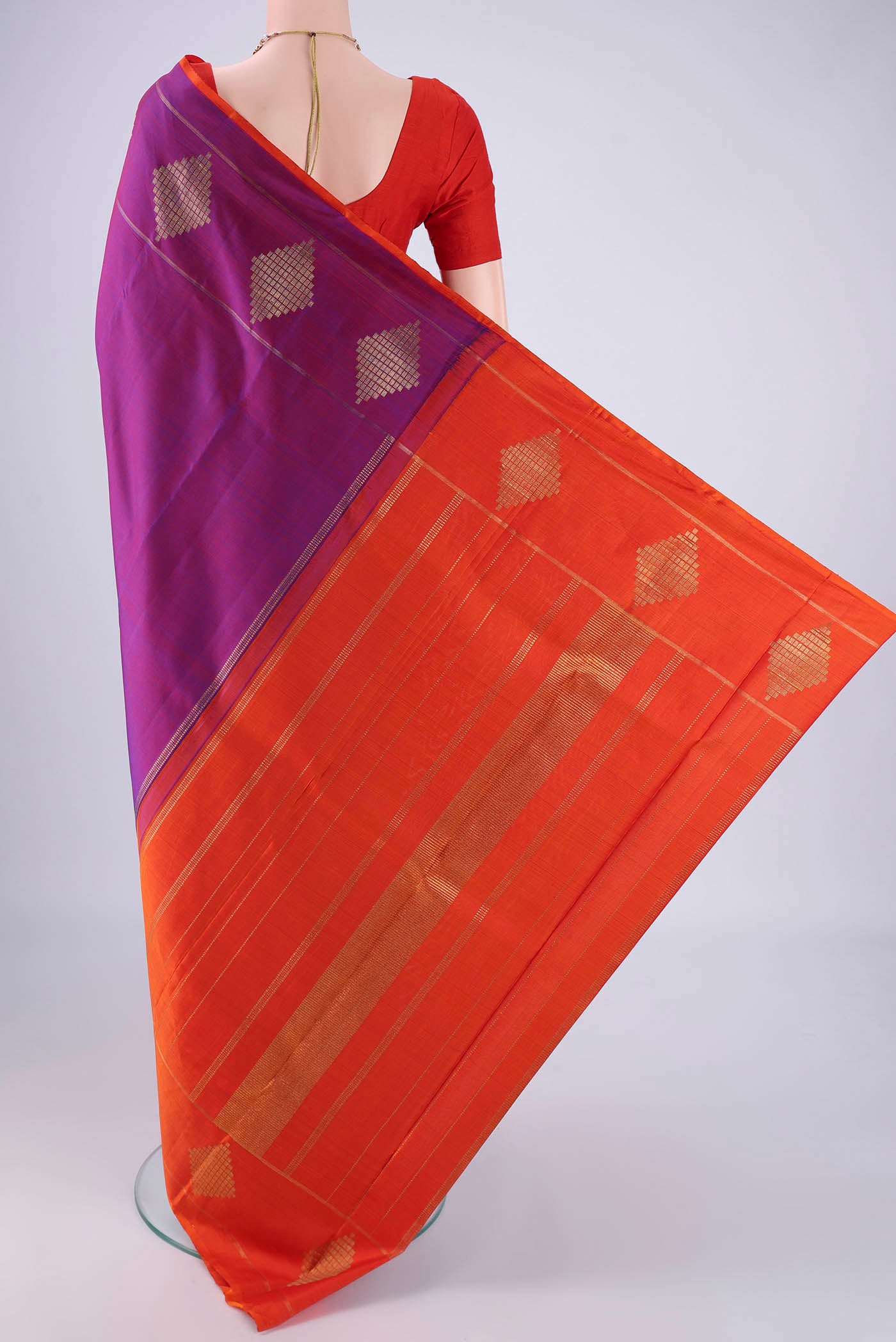Flat view of Purple Kanchipuram Silk Saree with Plain Body and Without Border. 