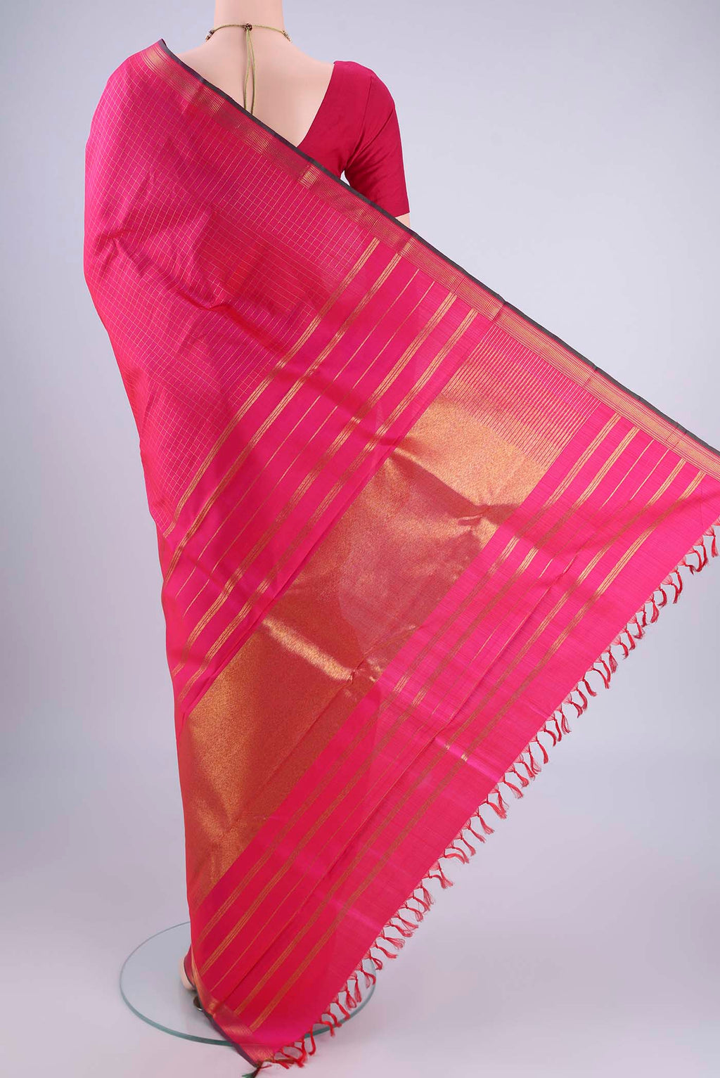 Flat view of Pure Silk Pure Zari Rani Pink Kanchipuram Saree with Checked design on the body and Zari Border. 