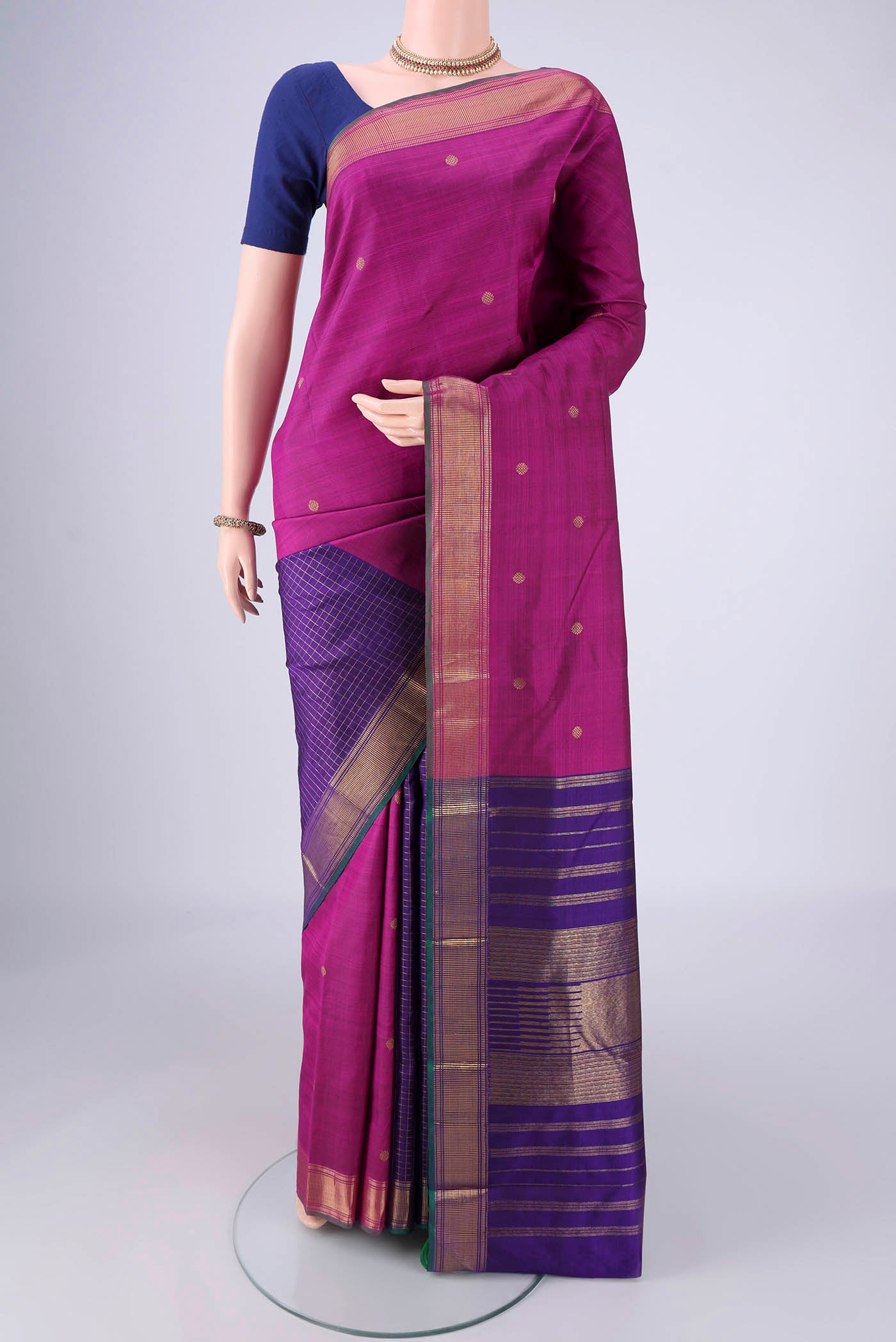 Pure Silk Pure Zari Magenta Kanchipuram Saree with Partli on the body and Zari Border.  displayed on a mannequin