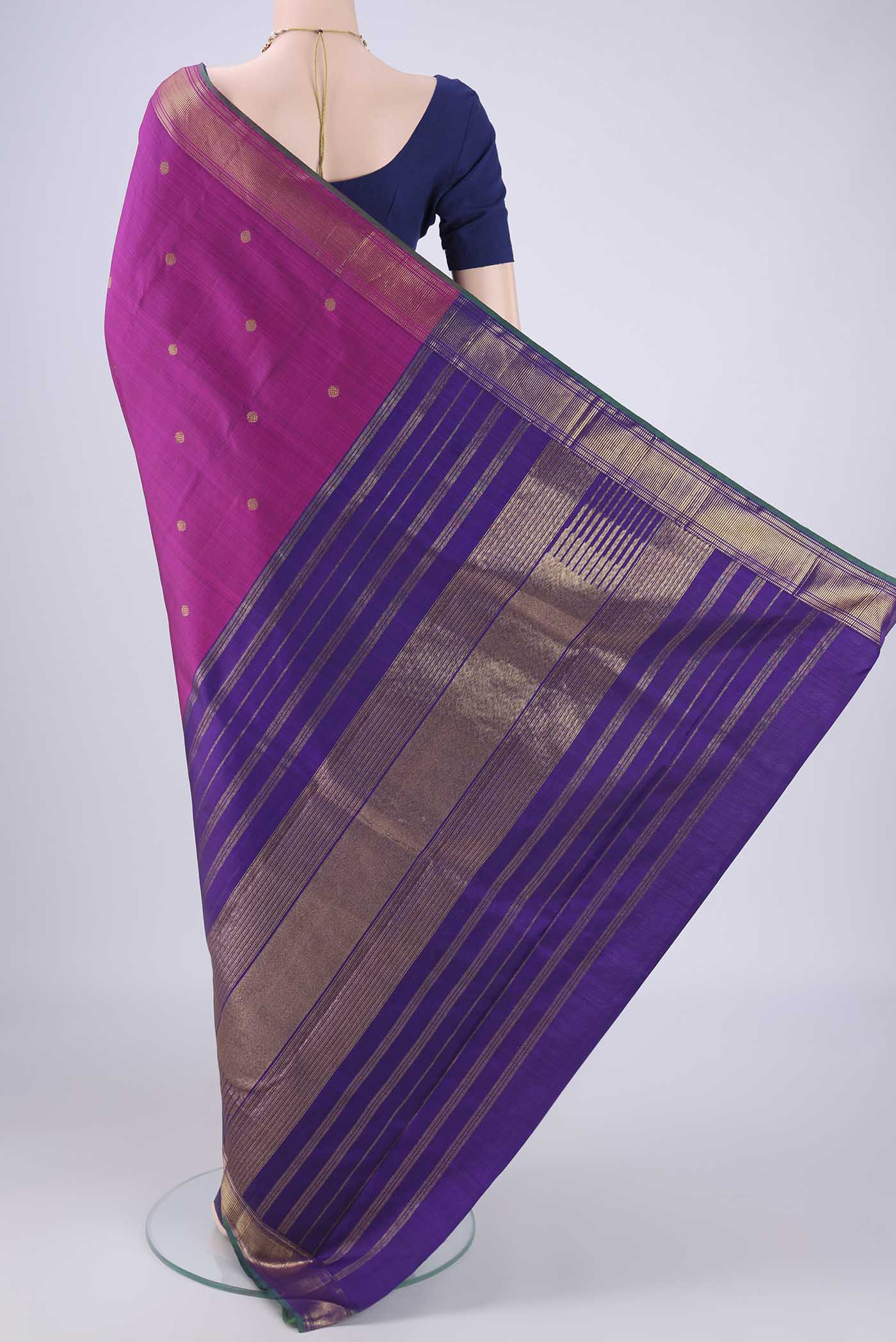 Flat view of Pure Silk Pure Zari Magenta Kanchipuram Saree with Partli on the body and Zari Border. 