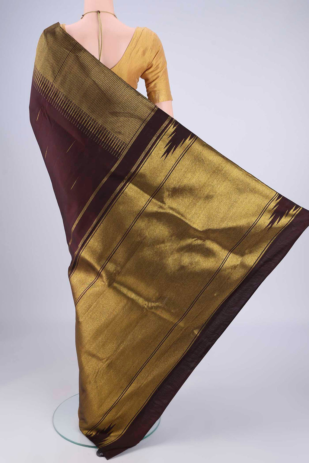 Flat view of Coffee Brown Kanjivaram Silk Saree with Zari Butta on the body and Zari Border. 