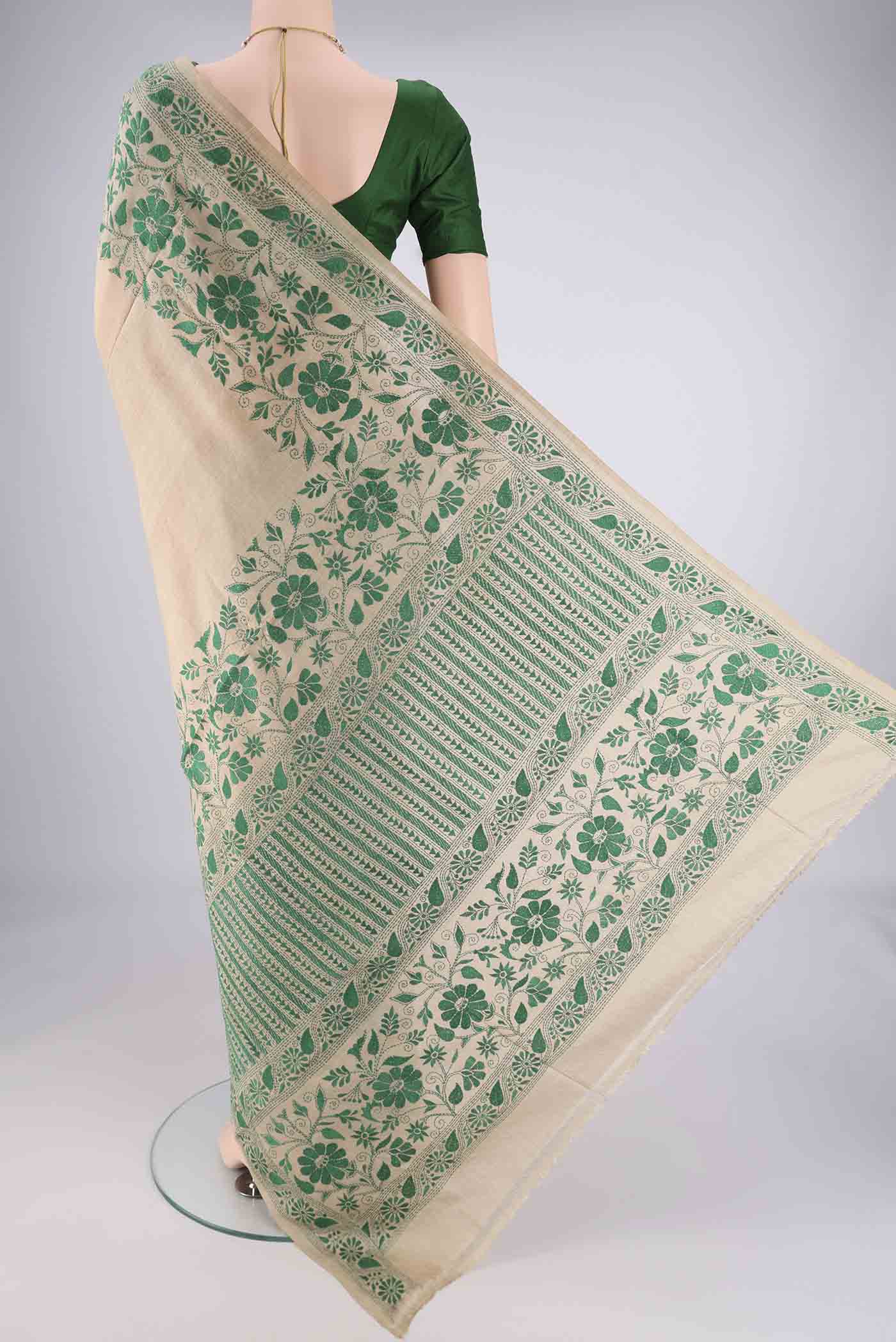 Flat view of Beige Tussar Silk Saree with Kantha Work on the body and Thread Border. 