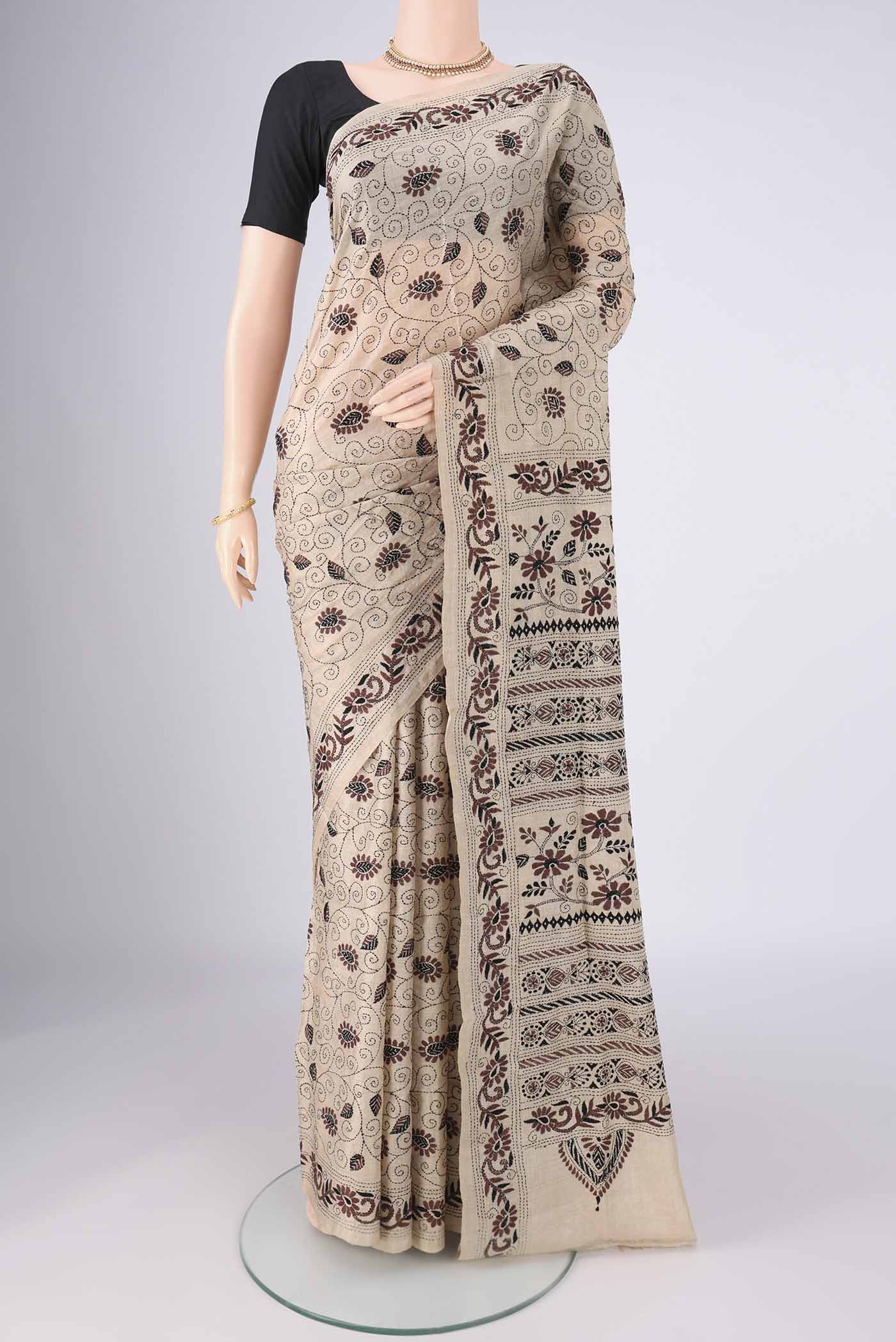 Beige Tussar Silk Saree with Kantha Work on the body and Thread Border.  displayed on a mannequin