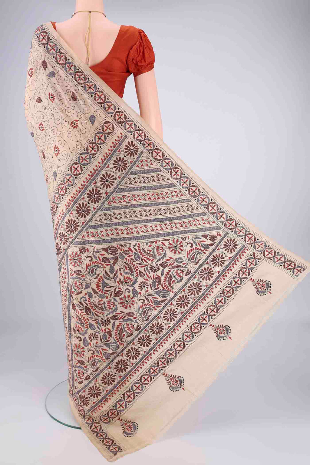 Flat view of Beige Tussar Silk Saree with Kantha Work on the body and Thread Border. 