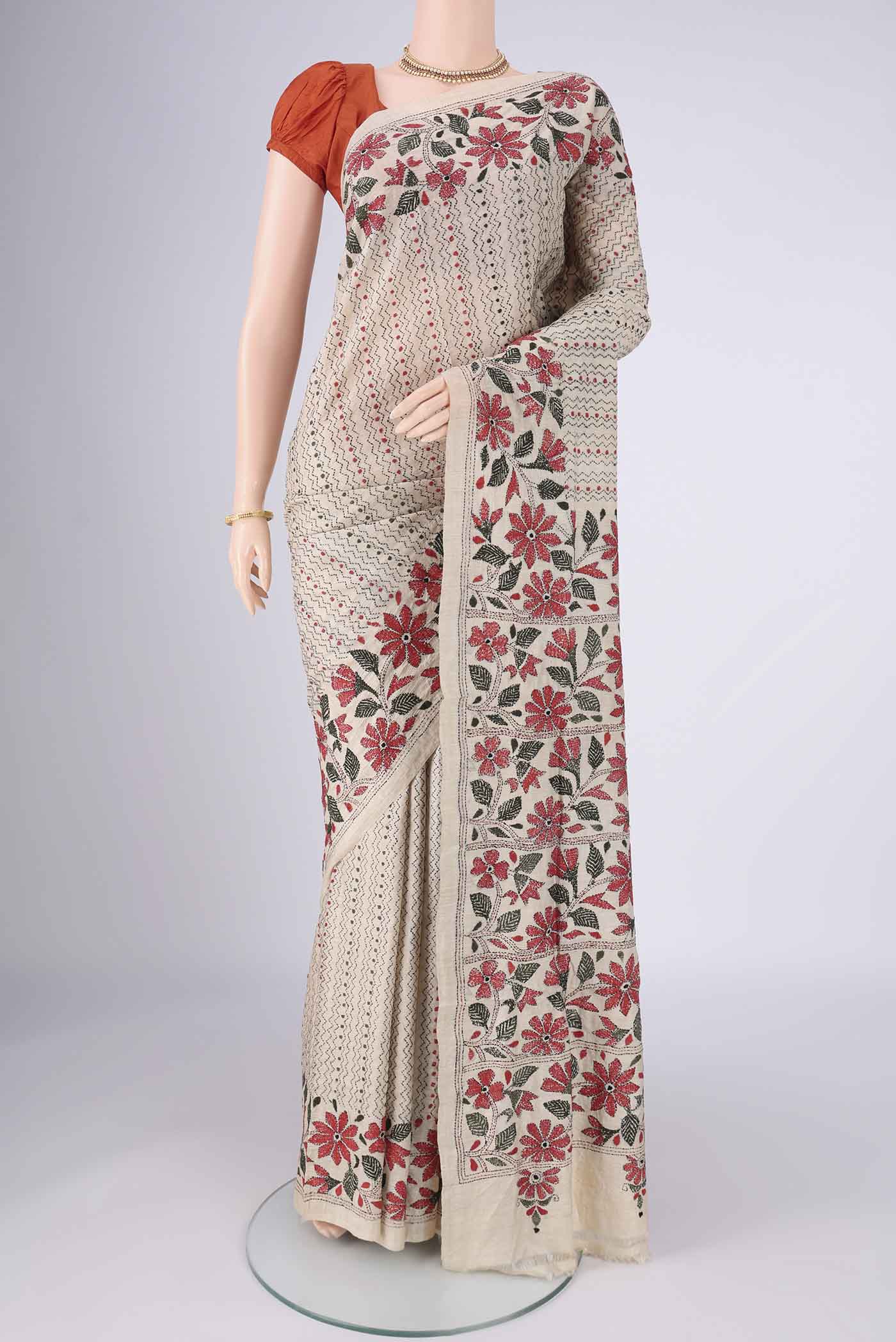 Beige Tussar Silk Saree with Kantha Work on the body and Thread Border.  displayed on a mannequin
