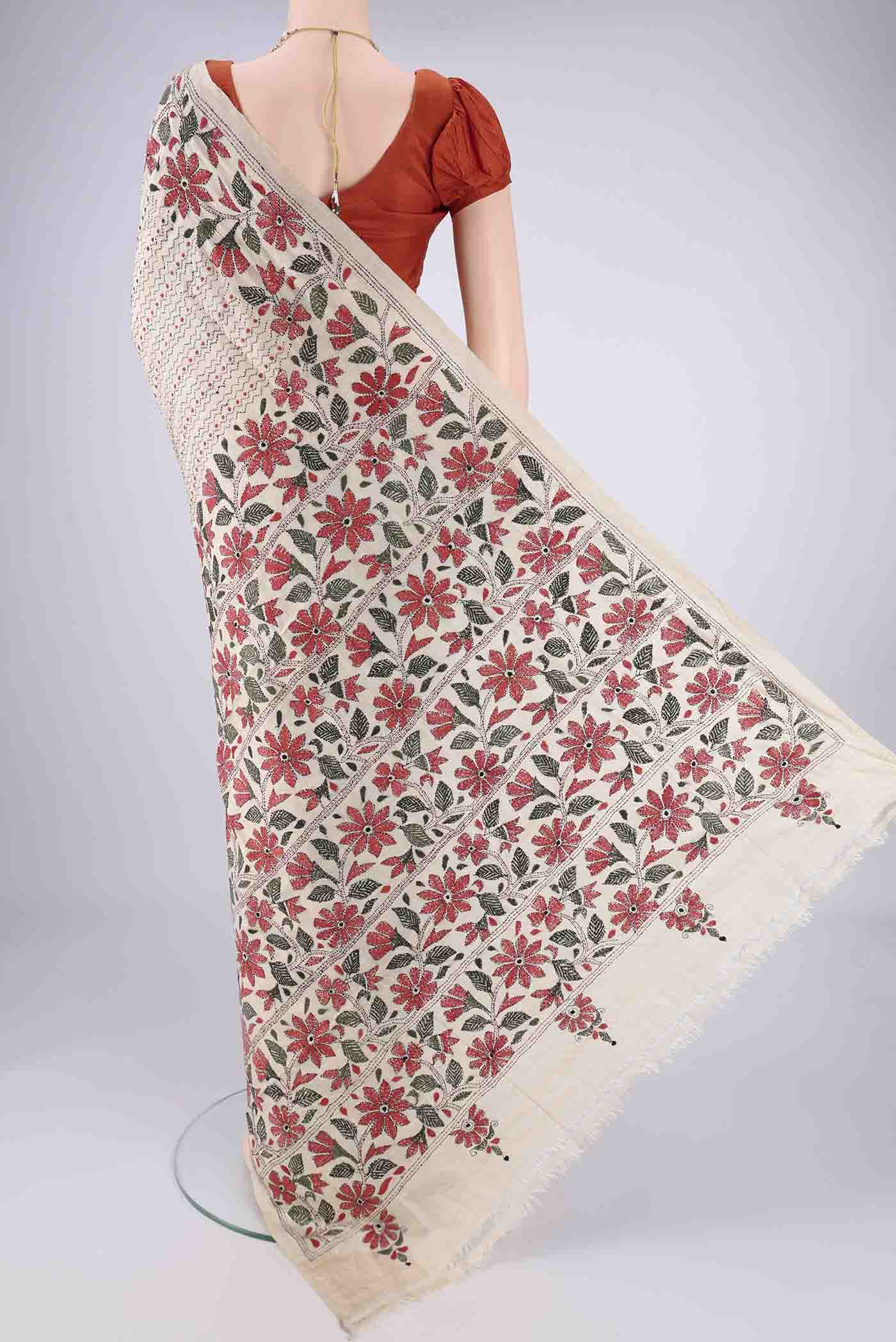 Flat view of Beige Tussar Silk Saree with Kantha Work on the body and Thread Border. 