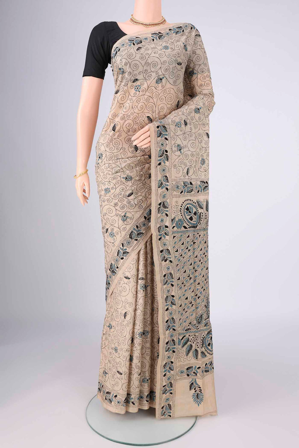 Beige Tussar Silk Saree with Kantha Work on the body and Thread Border.  displayed on a mannequin