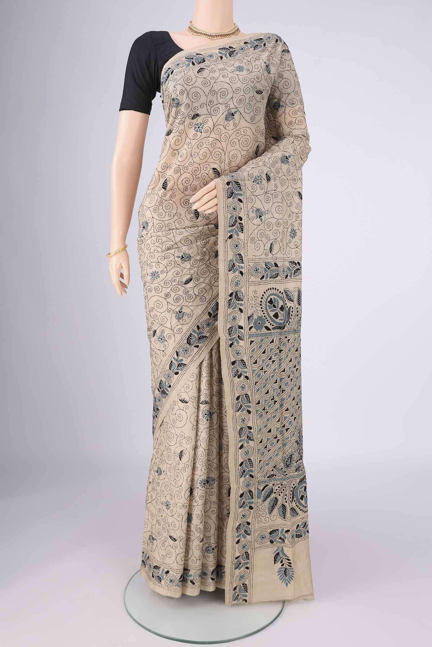 Beige Tussar Silk Saree with Kantha Work on the body and Thread Border.  displayed on a mannequin