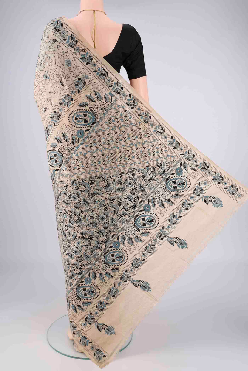 Flat view of Beige Tussar Silk Saree with Kantha Work on the body and Thread Border. 
