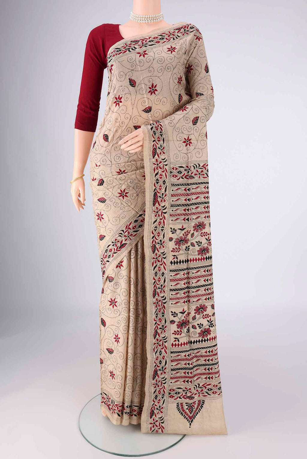 Beige Tussar Silk Saree with Kantha Work on the body and Thread Border.  displayed on a mannequin