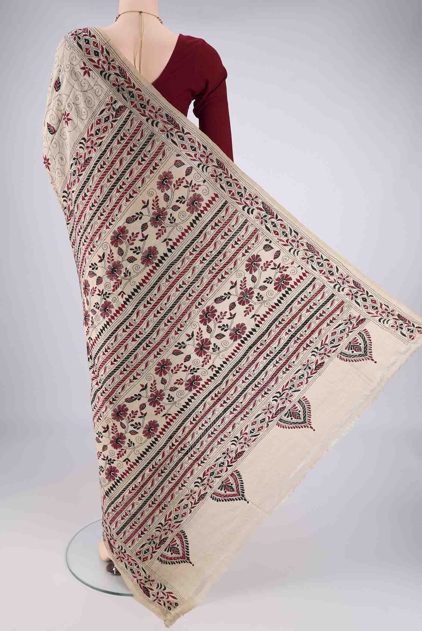 Flat view of Beige Tussar Silk Saree with Kantha Work on the body and Thread Border. 