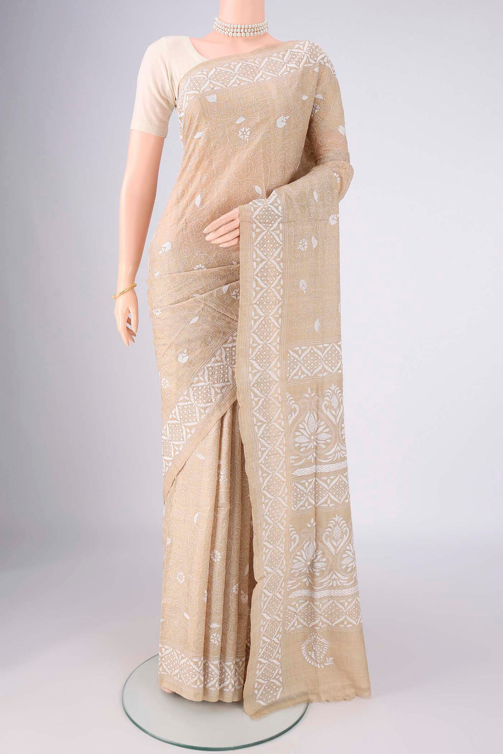 Beige Tussar Silk Saree with Kantha Work on the body and Thread Border.  displayed on a mannequin