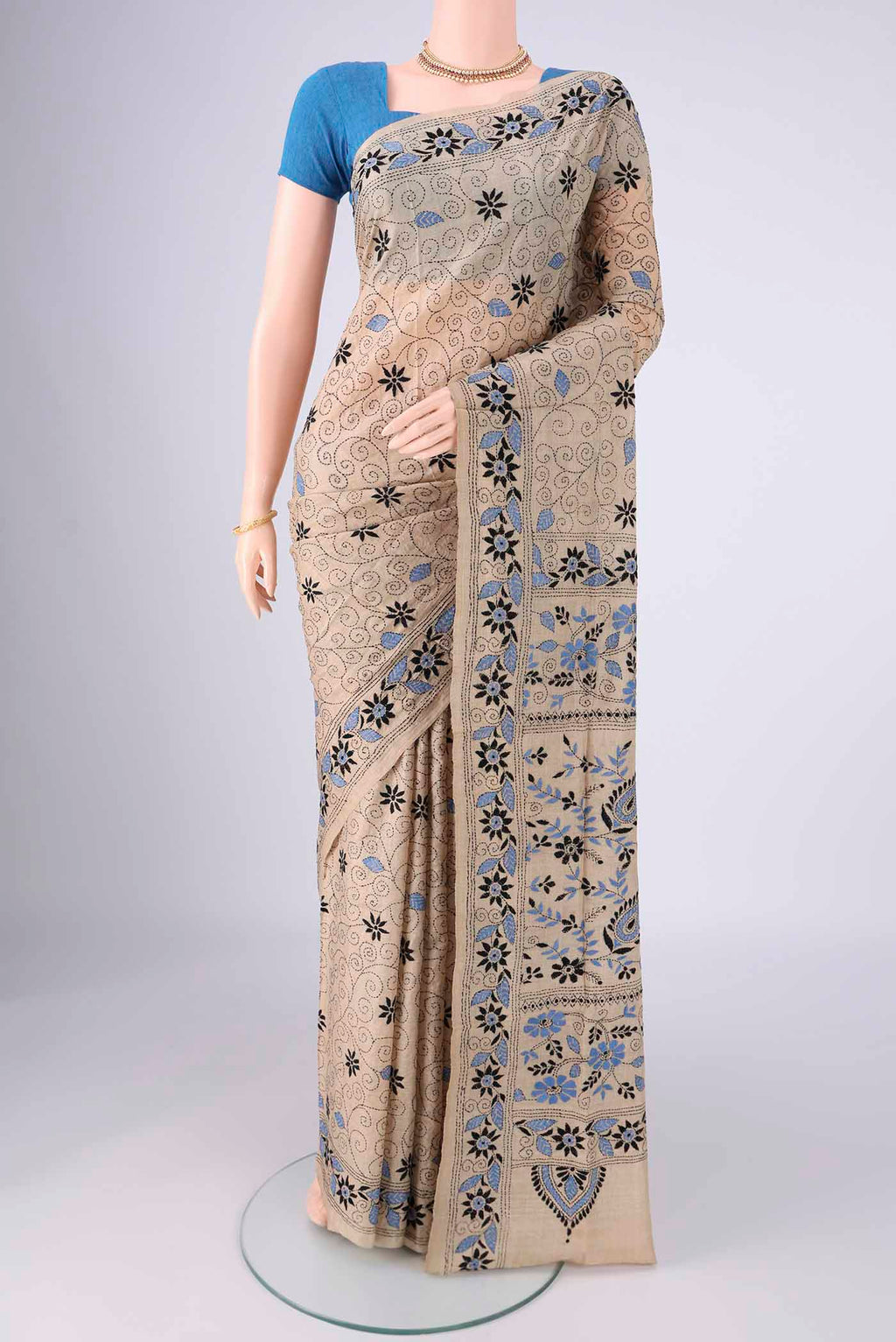 Beige Tussar Silk Saree with Kantha Work on the body and Thread Border.  displayed on a mannequin