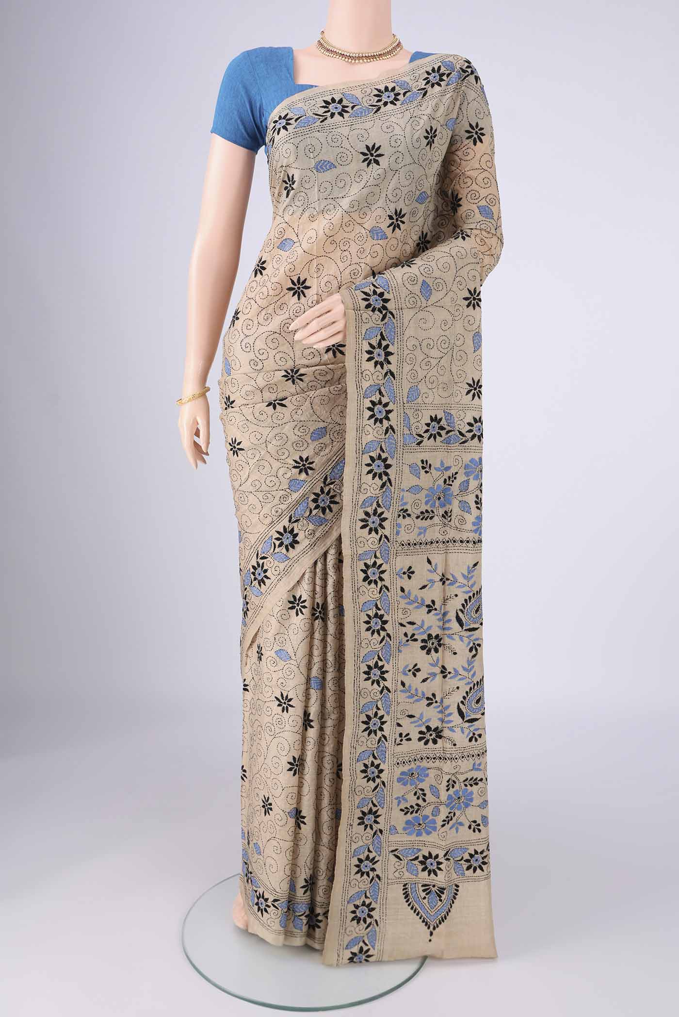 Beige Tussar Silk Saree with Kantha Work on the body and Thread Border.  displayed on a mannequin