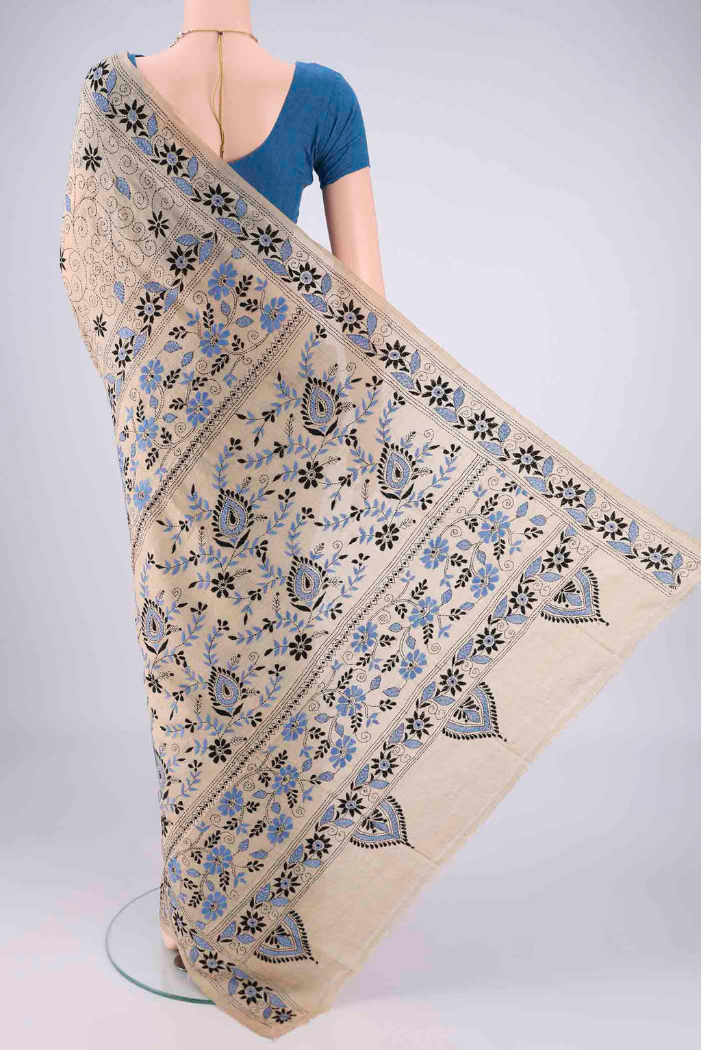 Flat view of Beige Tussar Silk Saree with Kantha Work on the body and Thread Border. 