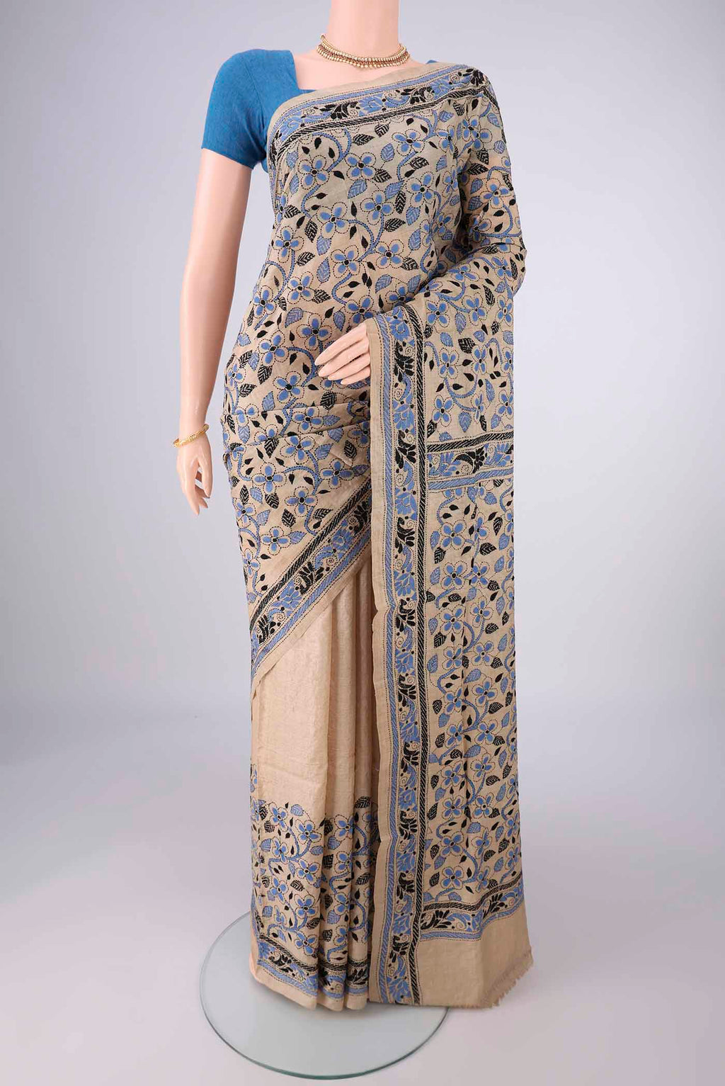 Beige Tussar Silk Saree with Kantha Work on the body and Thread Border.  displayed on a mannequin