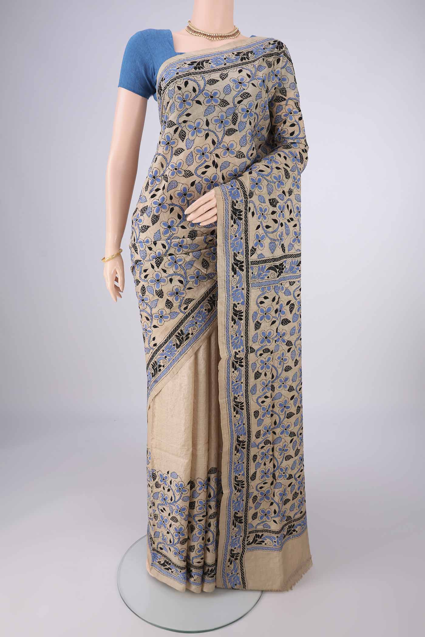 Beige Tussar Silk Saree with Kantha Work on the body and Thread Border.  displayed on a mannequin