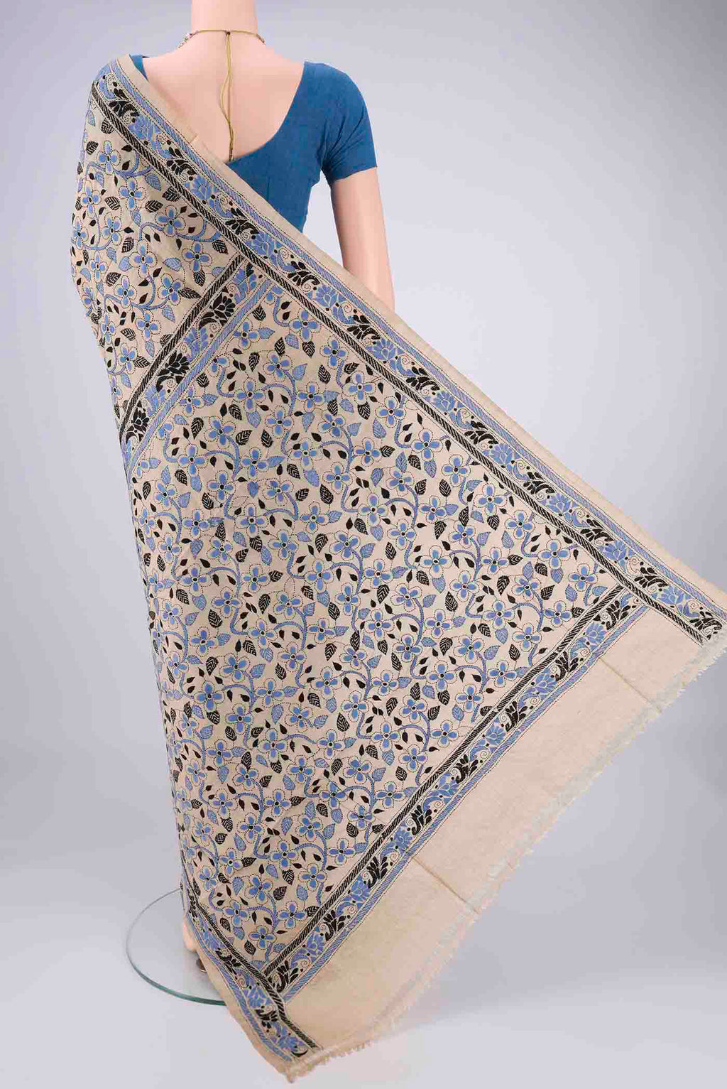 Flat view of Beige Tussar Silk Saree with Kantha Work on the body and Thread Border. 