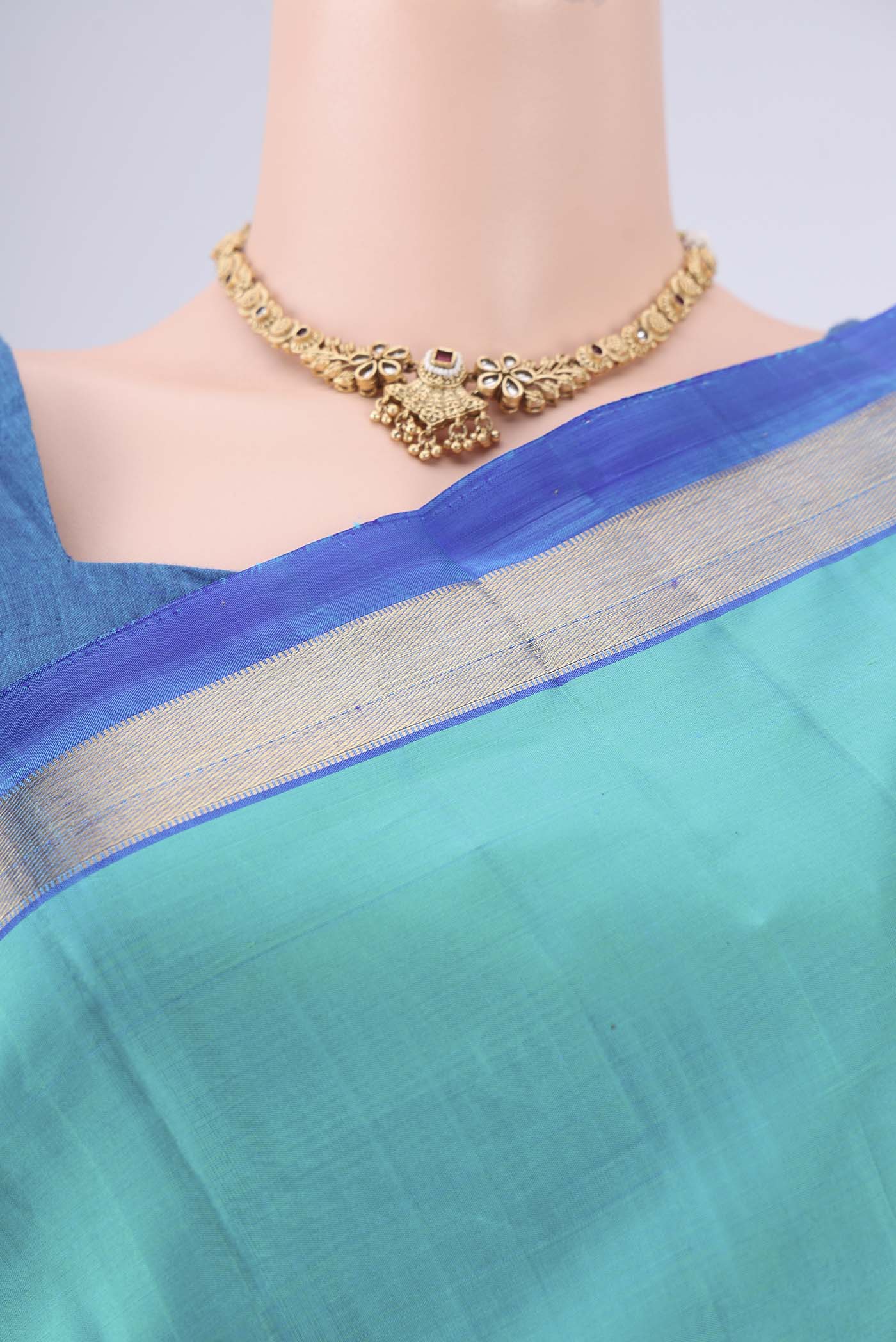 Border image of Turquoise Kanjivaram Saree with Plain Body and Zari Border. 
