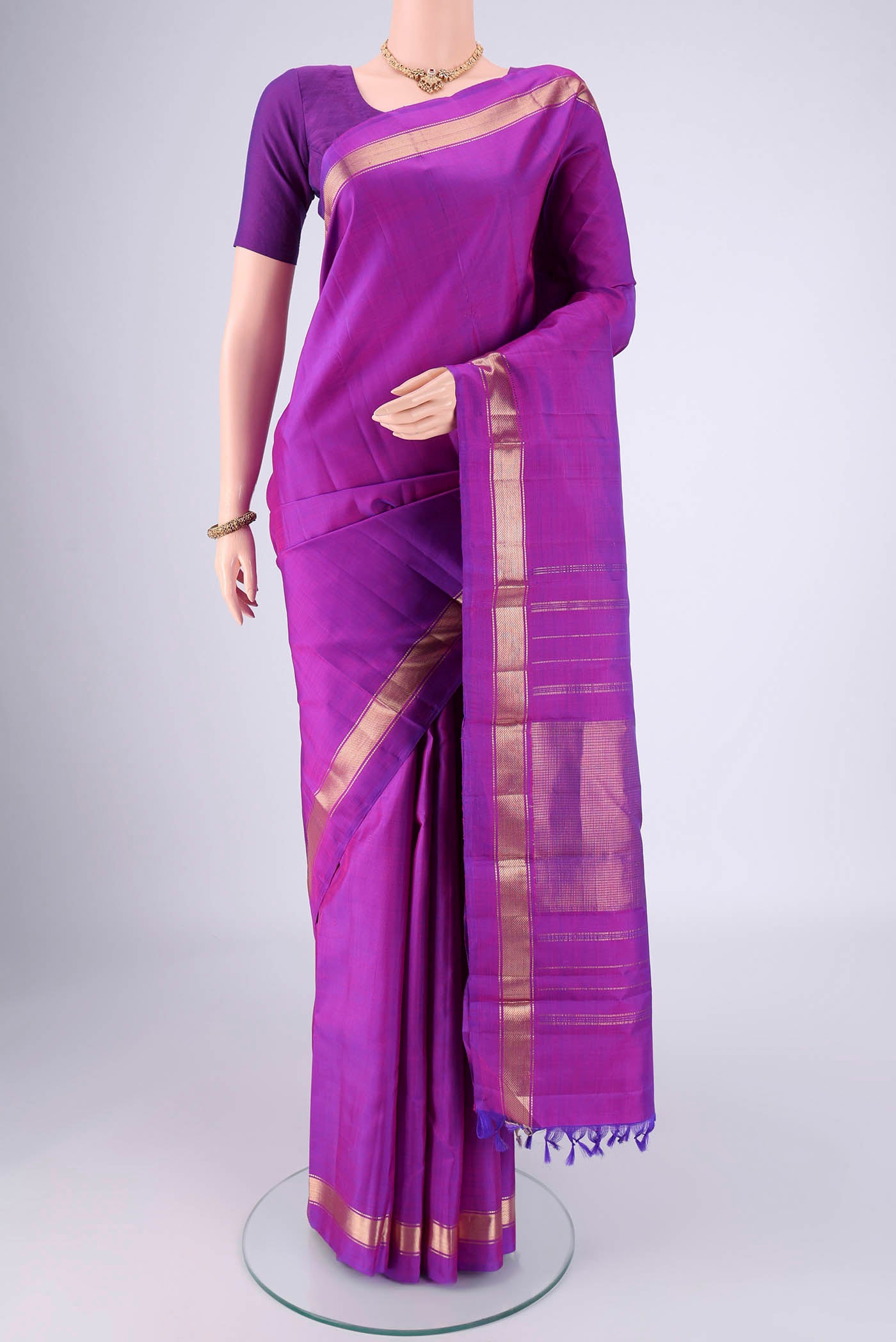 Purple Dual Tone Kanjivaram Saree with Plain Body and Zari Border.  displayed on a mannequin
