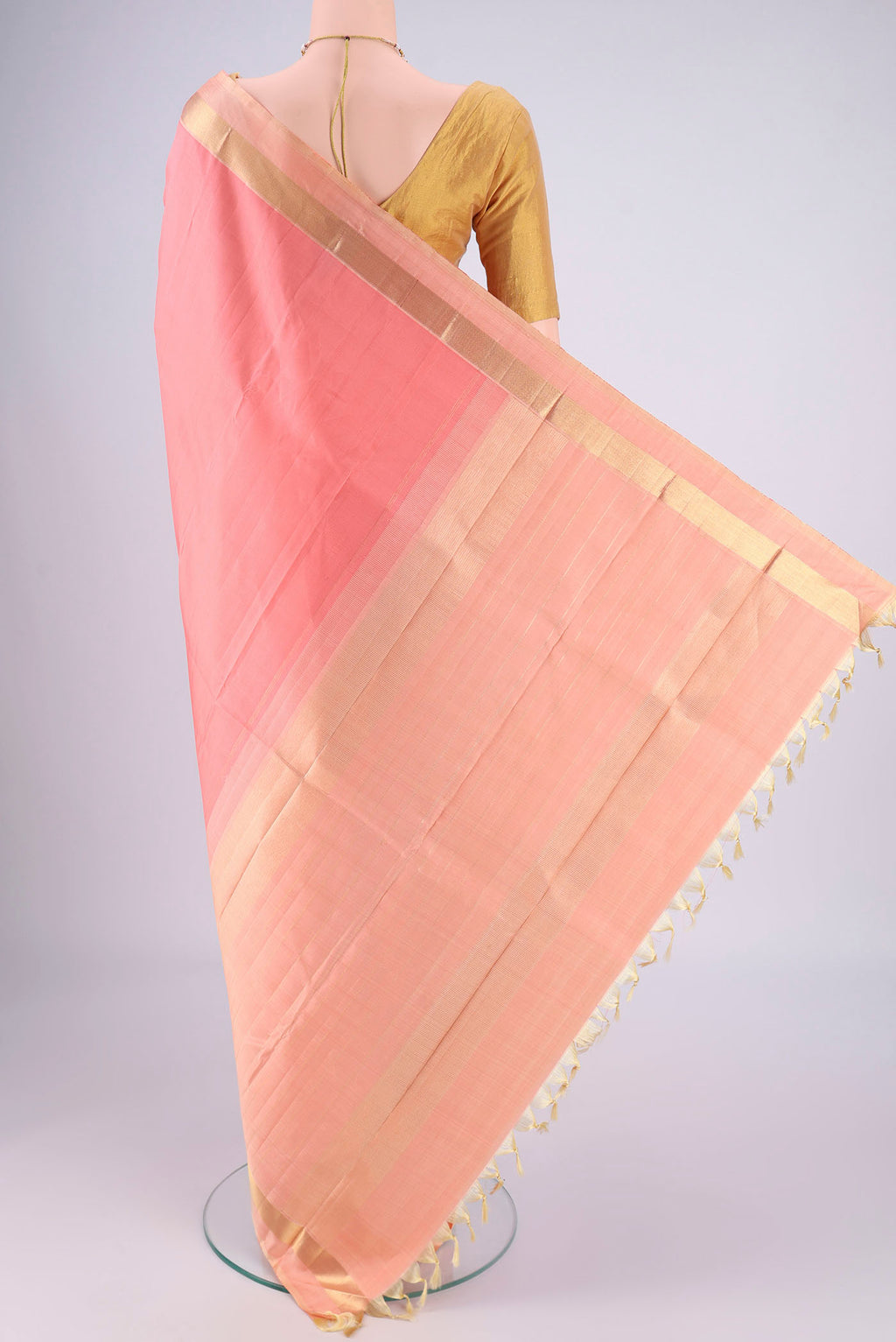 Flat view of Peach Kanjivaram Silk Saree with Plain Body and Zari Border. 