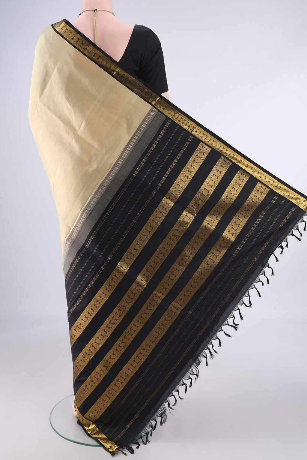 Flat view of Pure Silk Beige Kanjivaram Saree with Plain Body and Zari Border. 