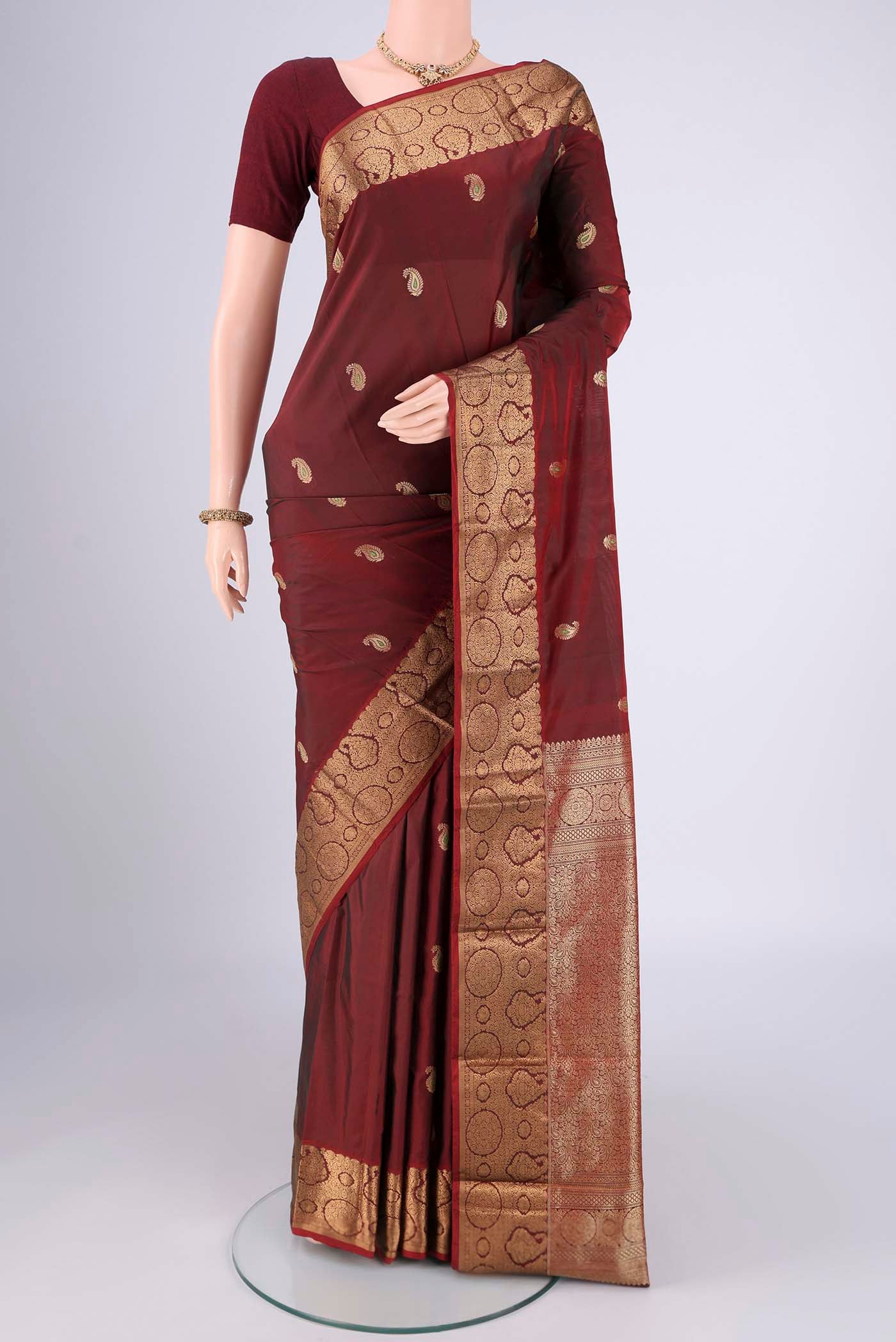 Maroon Dual Tone Blended Bangalore Silk Saree with Zari Butta on the body and Zari Border.  displayed on a mannequin