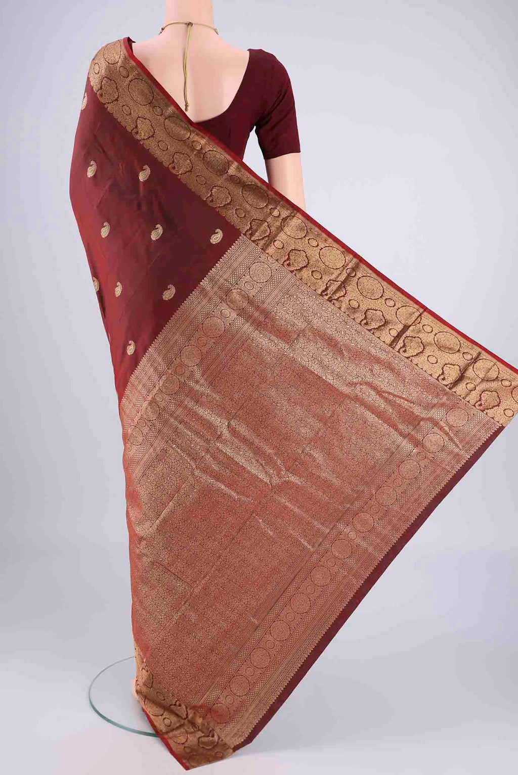 Flat view of Maroon Dual Tone Blended Bangalore Silk Saree with Zari Butta on the body and Zari Border. 
