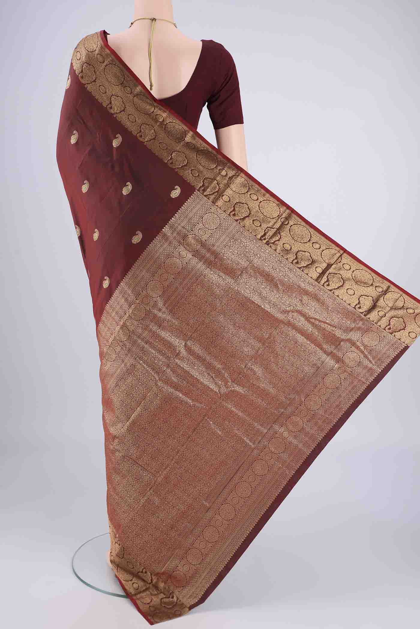 Flat view of Maroon Dual Tone Blended Bangalore Silk Saree with Zari Butta on the body and Zari Border. 