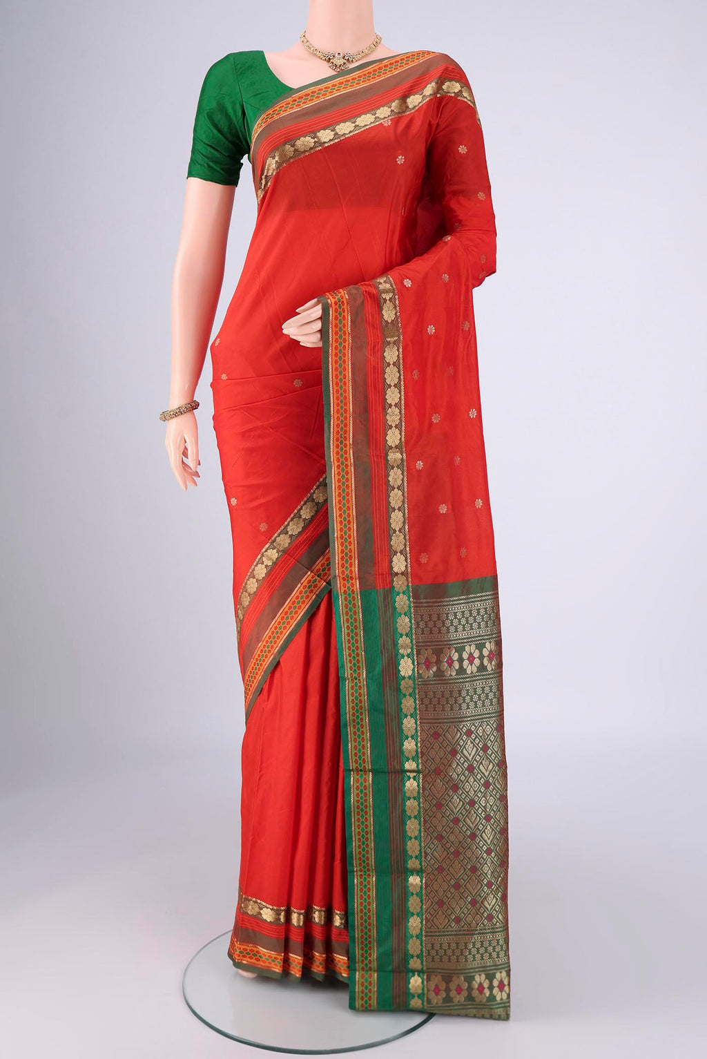 Orange Dual Tone Blended Bangalore Silk Saree with Zari Butta on the body and Zari Border.  displayed on a mannequin