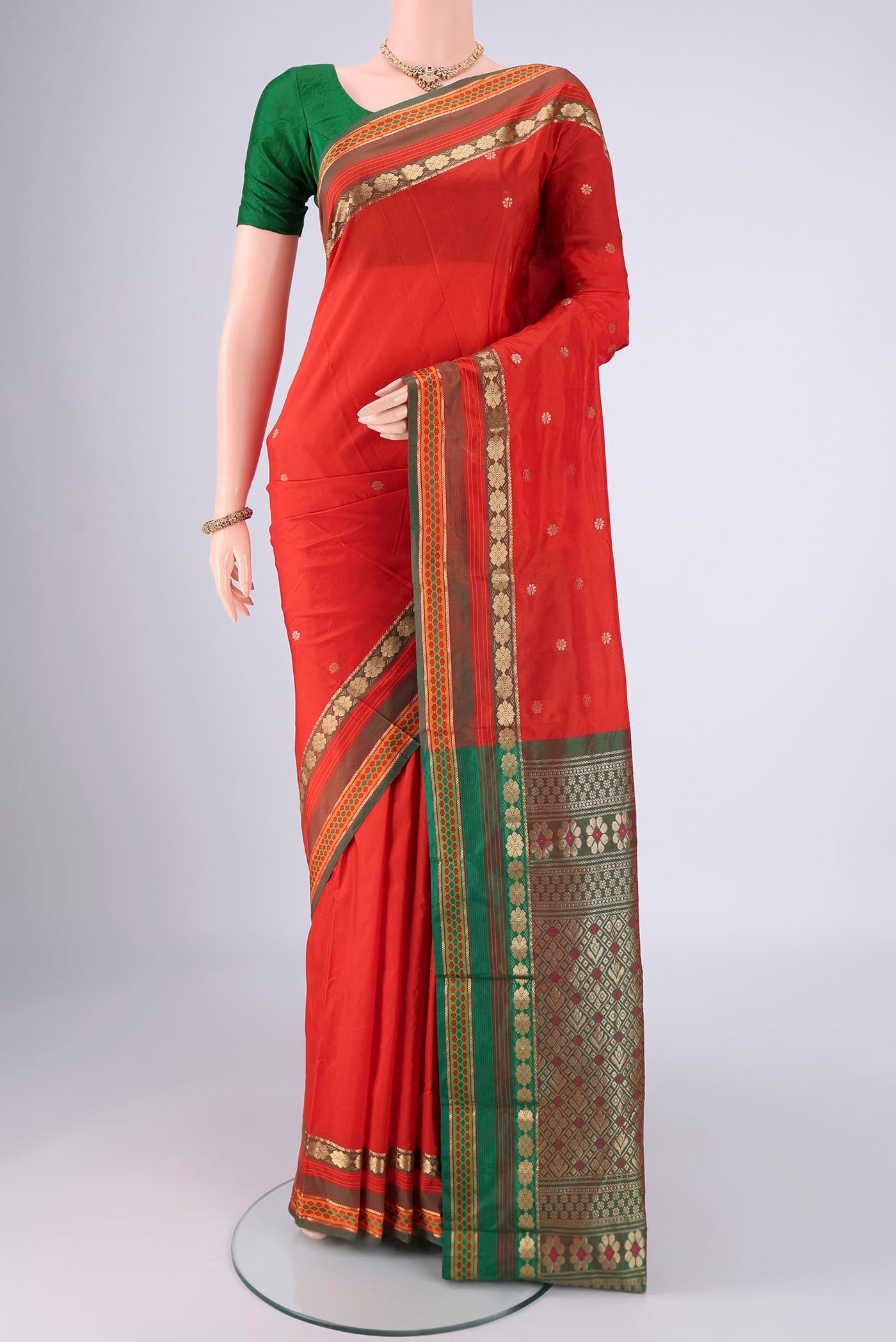 Orange Dual Tone Blended Bangalore Silk Saree with Zari Butta on the body and Zari Border.  displayed on a mannequin