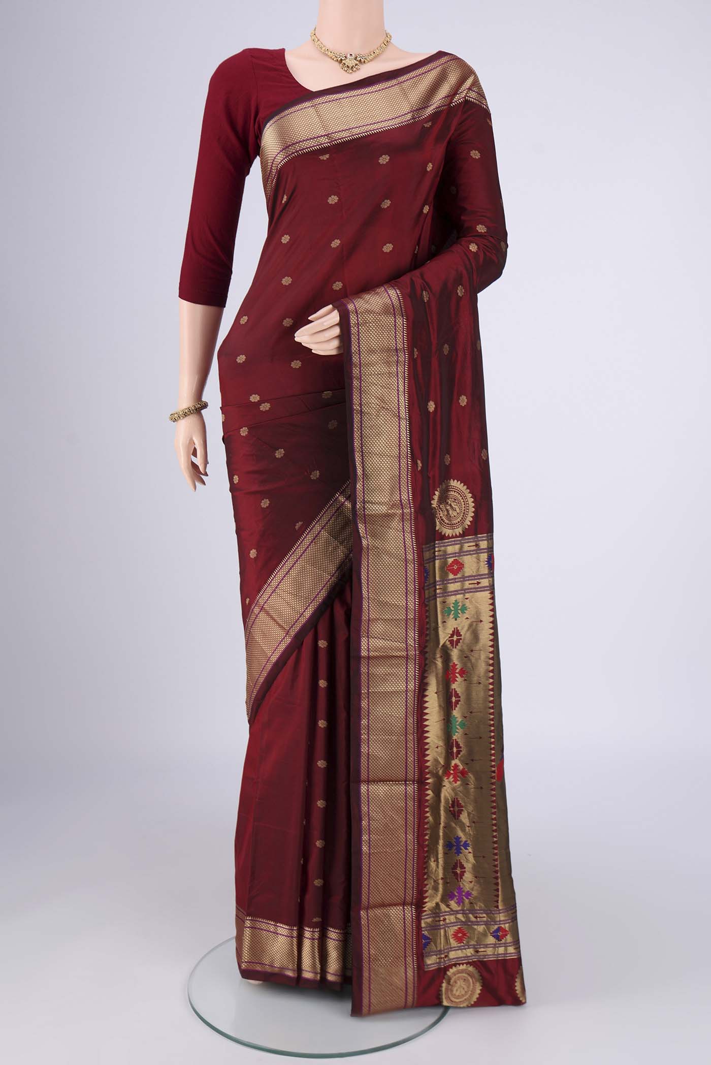 Maroon Dual Tone Blended Bangalore Silk Saree with Zari Butta on the body and Zari Border.  displayed on a mannequin