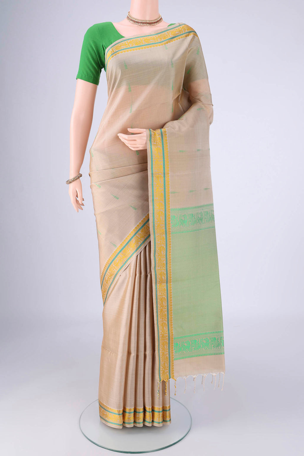 Beige Soft Silk Saree with Thread Butta on the body and Thread Border.  displayed on a mannequin