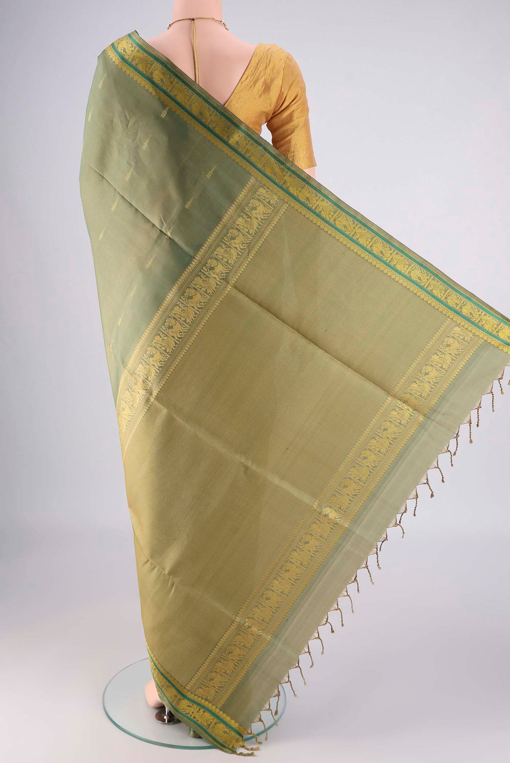 Flat view of Sage Green Soft Silk Saree with Stripes on the body and Zari And Thread Border. 