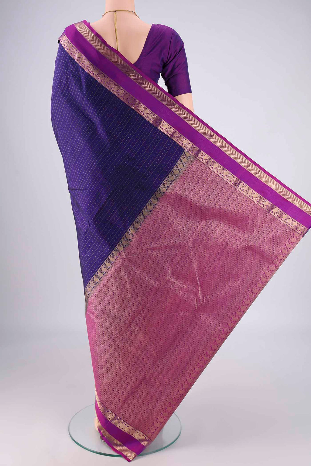 Flat view of Dark Blue Kanchipuram Silk Saree with Zari Butta on the body and Zari Border. 