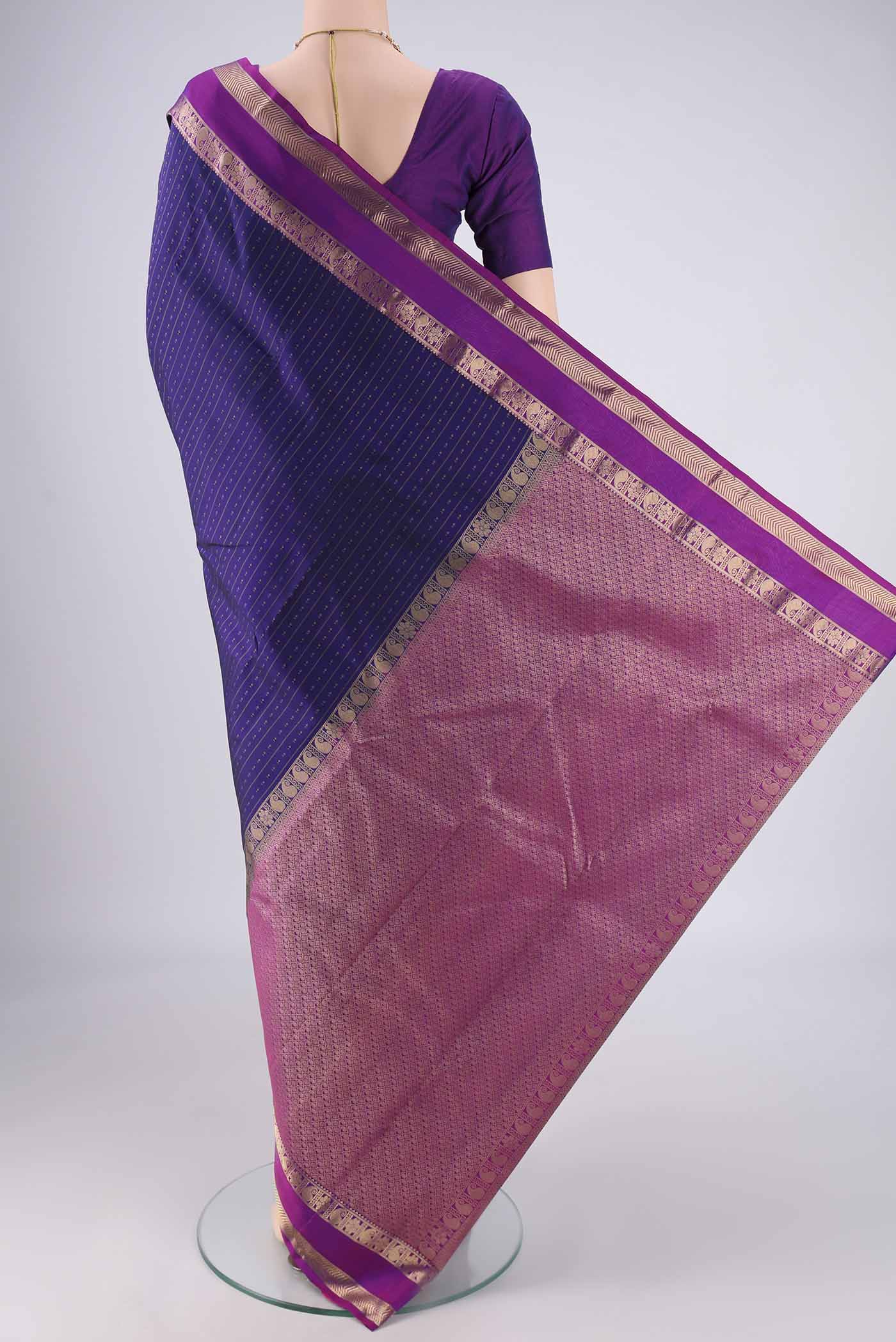 Flat view of Dark Blue Kanchipuram Silk Saree with Zari Butta on the body and Zari Border. 