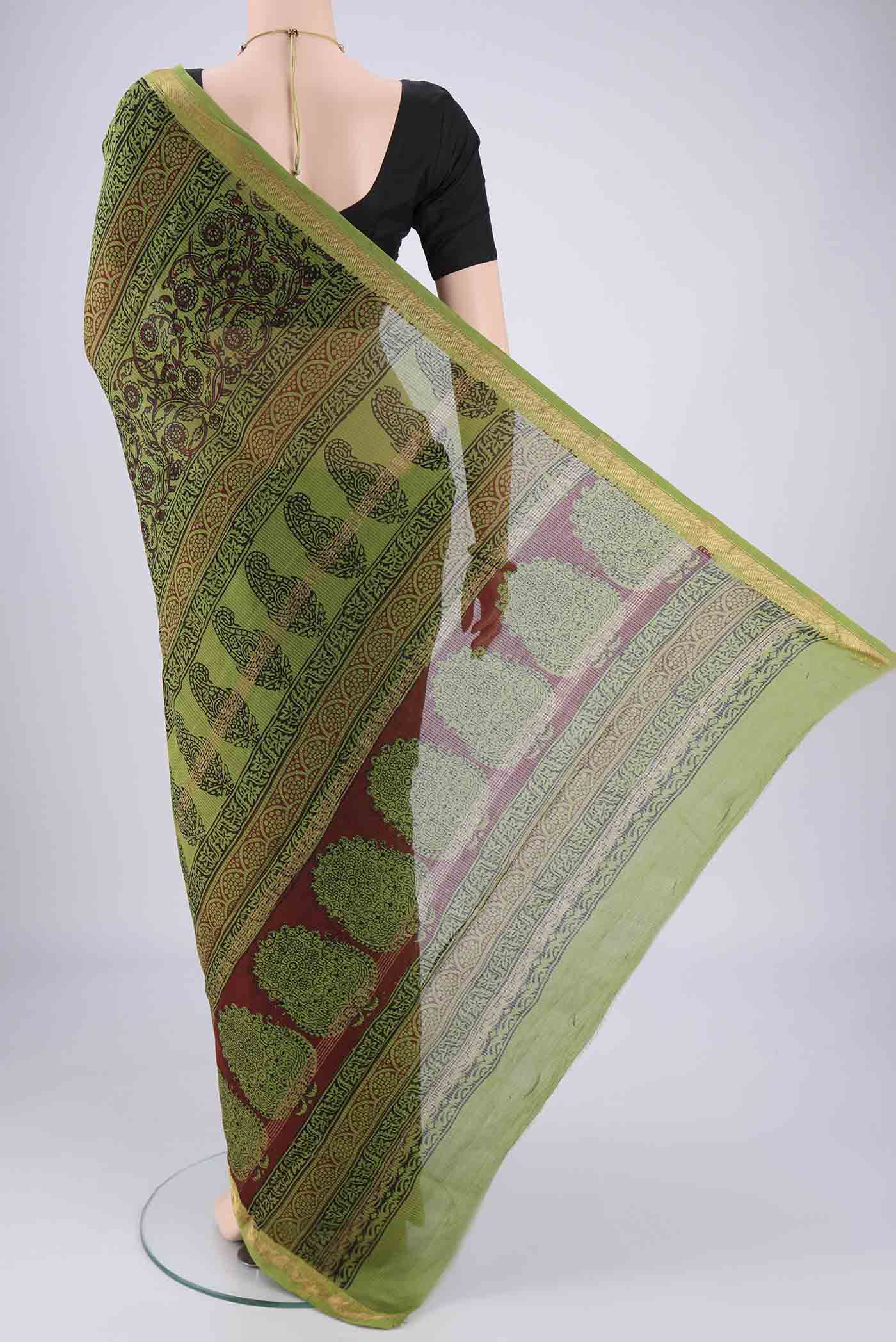 Flat view of Mehandi Green Maheshwari Silk Cotton Saree with Printed design on the body and Zari Border. 