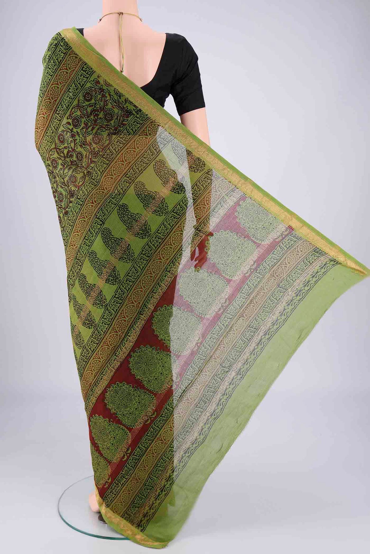 Flat view of Mehandi Green Maheshwari Silk Cotton Saree with Printed design on the body and Zari Border. 