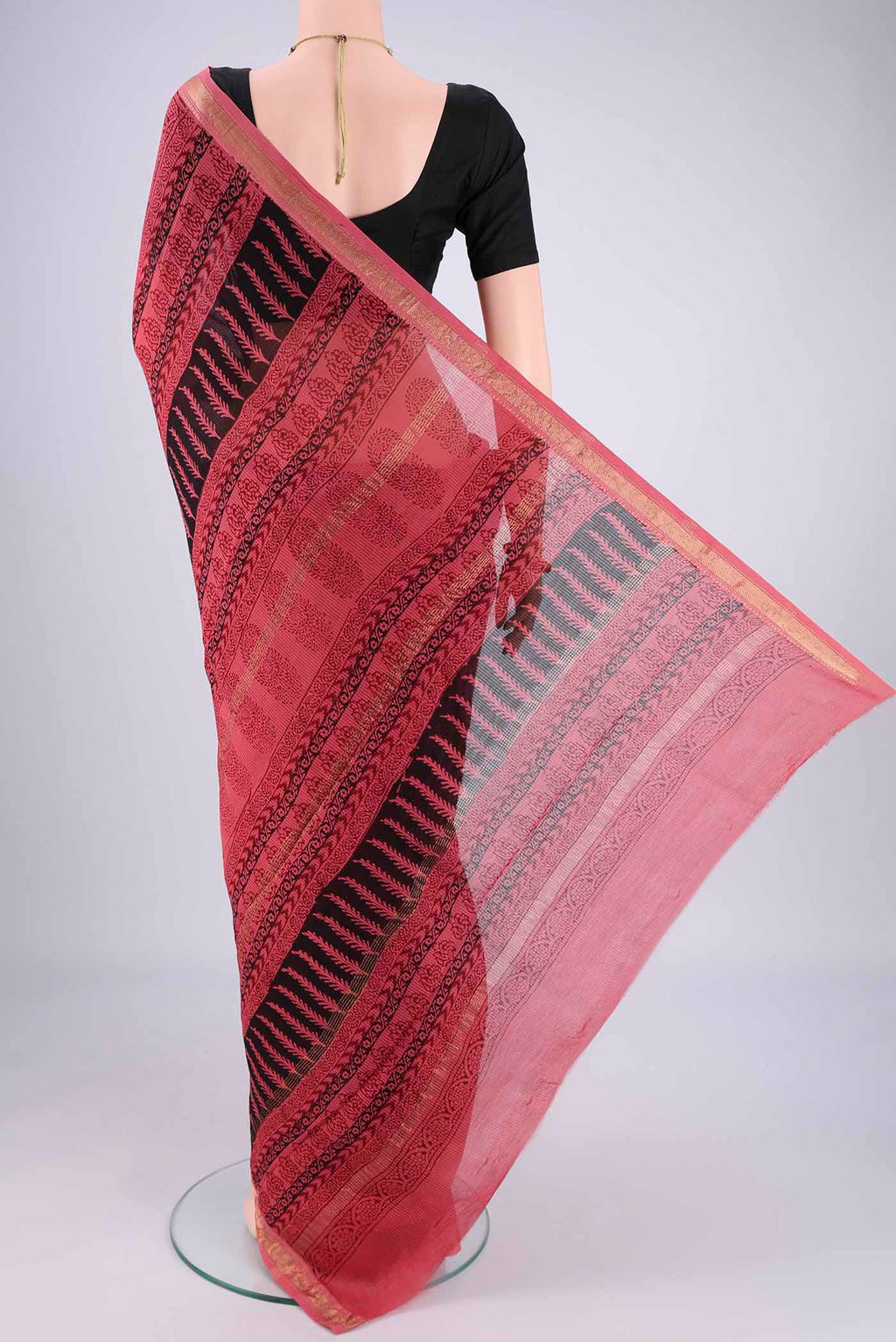 Flat view of Coral Maheshwari Silk Cotton Saree with Printed design on the body and Zari Border. 
