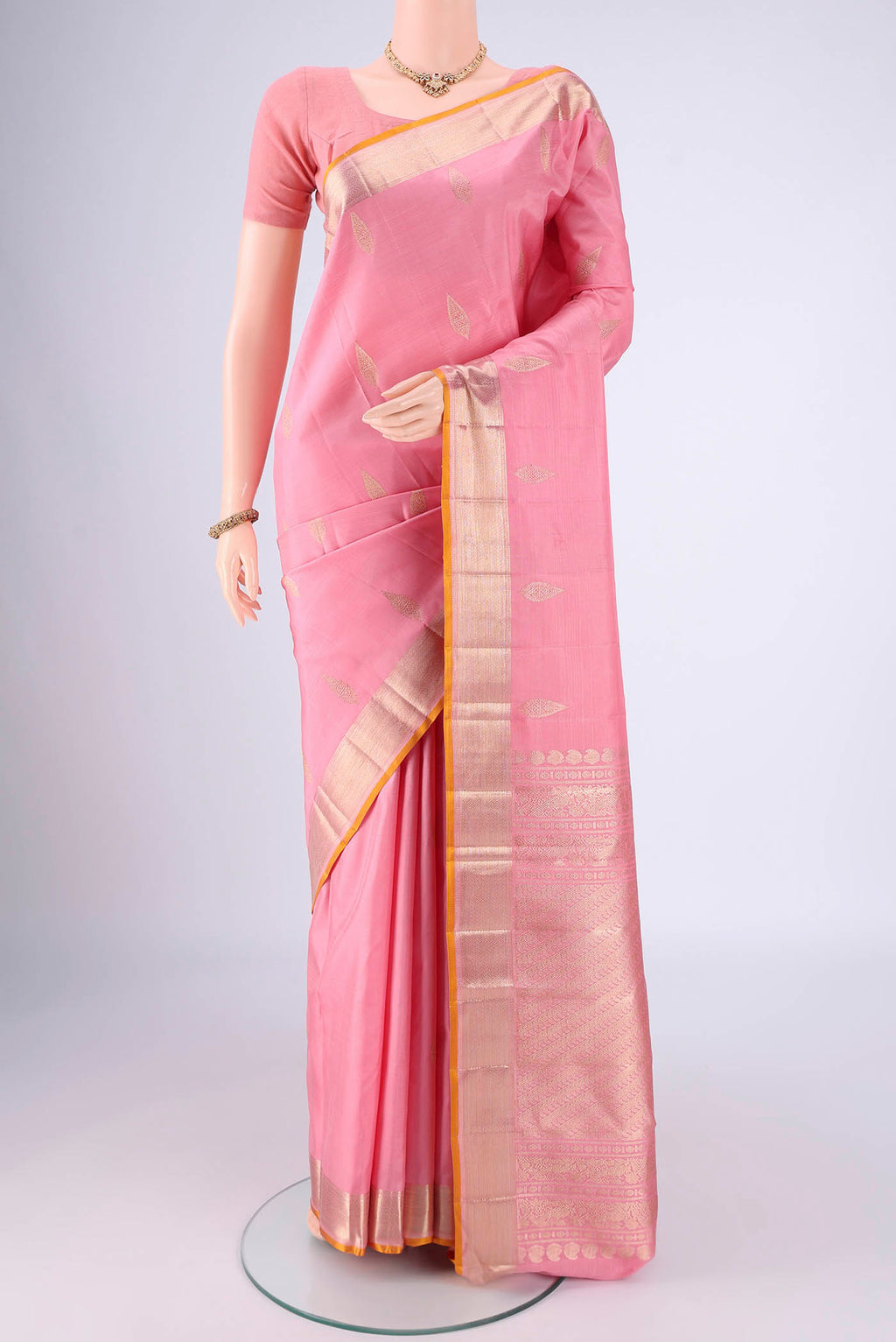 Rose pink Nangavalli Silk [ Salem ] Saree with Zari Butta on the body and Zari Border.  displayed on a mannequin
