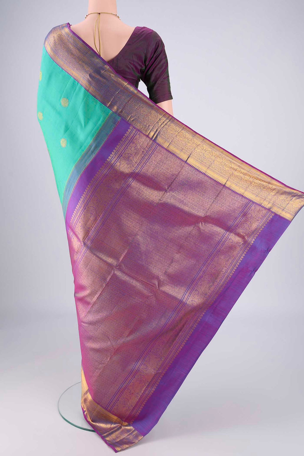Flat view of Turquoise Kanjivaram Silk Saree with Zari Butta on the body and Zari Border. 