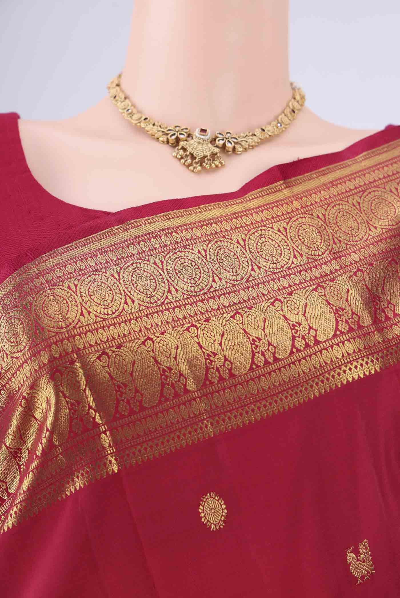Border image of Maroon Dual Tone Kanjivaram Saree with Zari Butta on the body and Zari Border. 