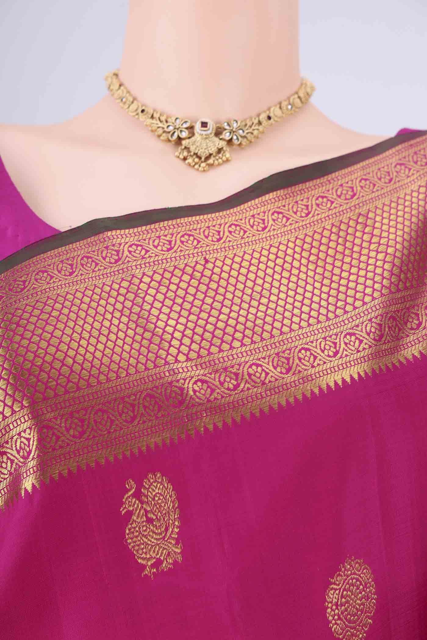 Border image of Rani Pink Dual Tone Kanjivaram Saree with Zari Butta on the body and Zari Border. 