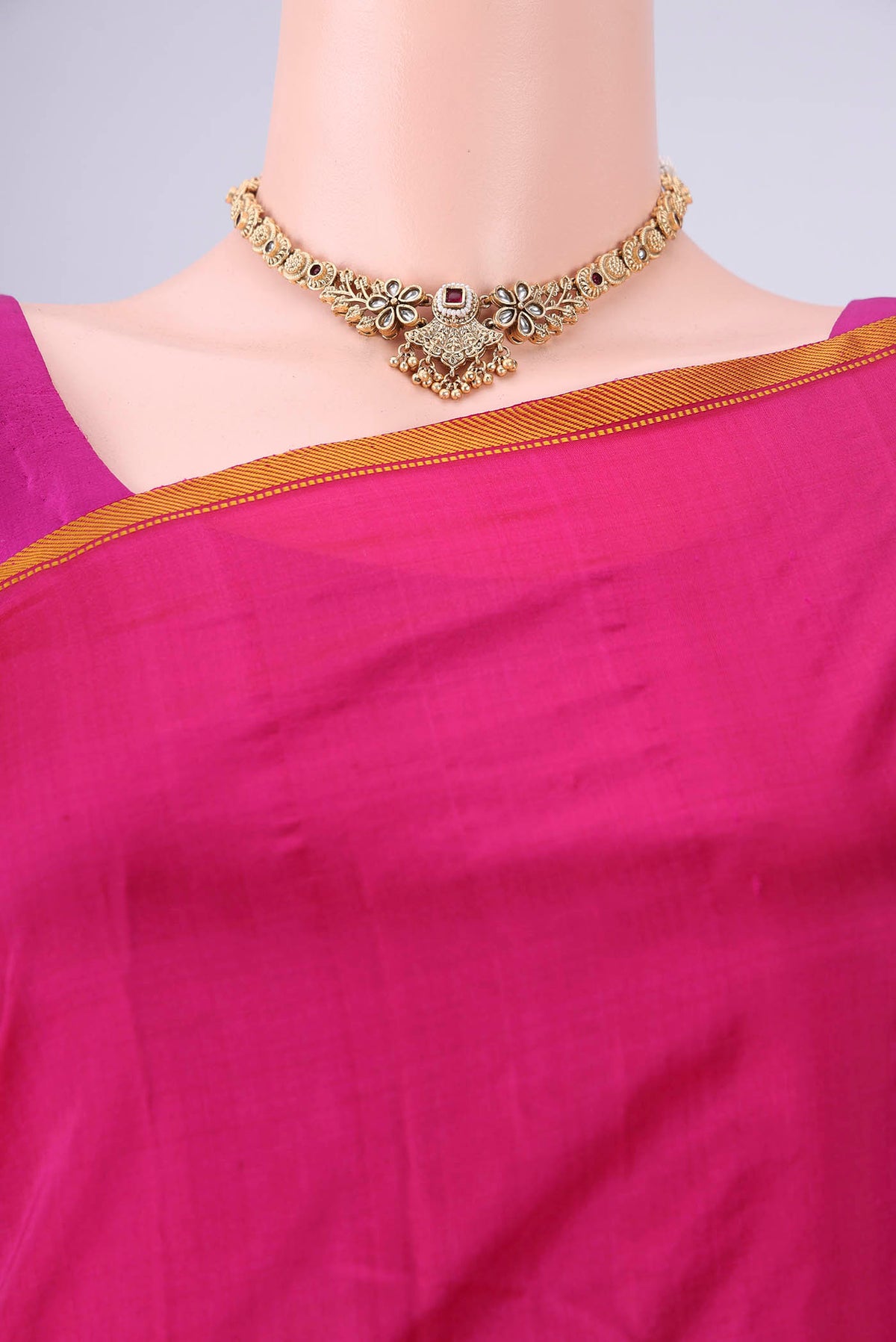 Border image of Rani Pink Kanchipuram Silk Saree with Plain Body and Thread Border. 