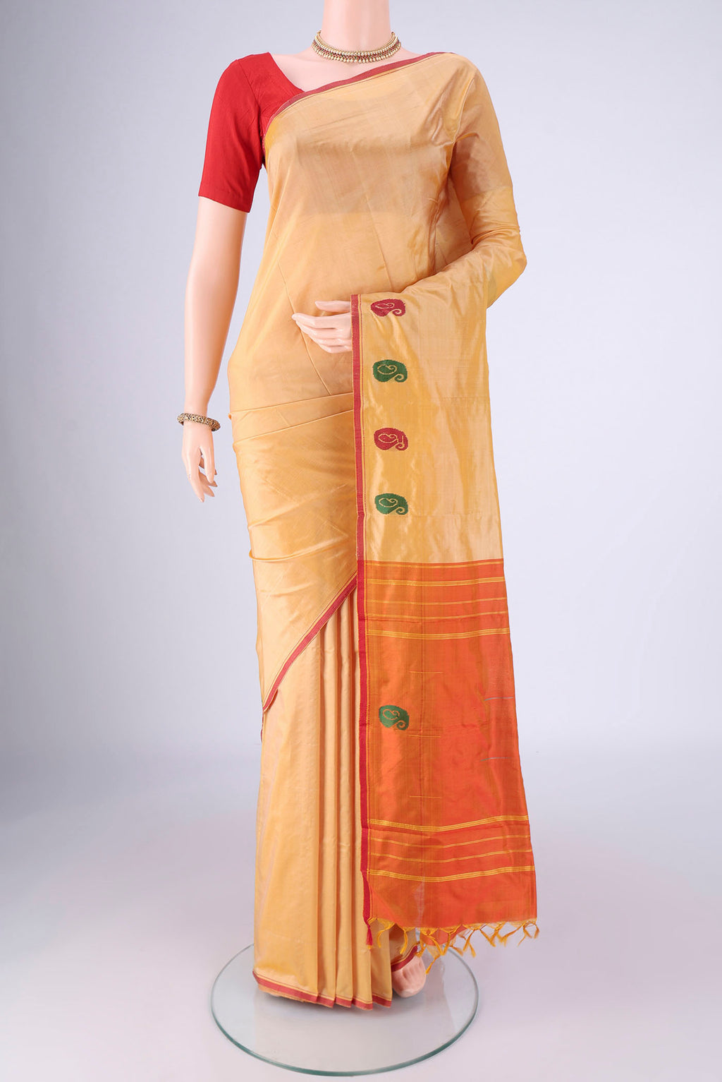 Sandal Kanchipuram Silk Saree with Plain Body and Thread Border.  displayed on a mannequin